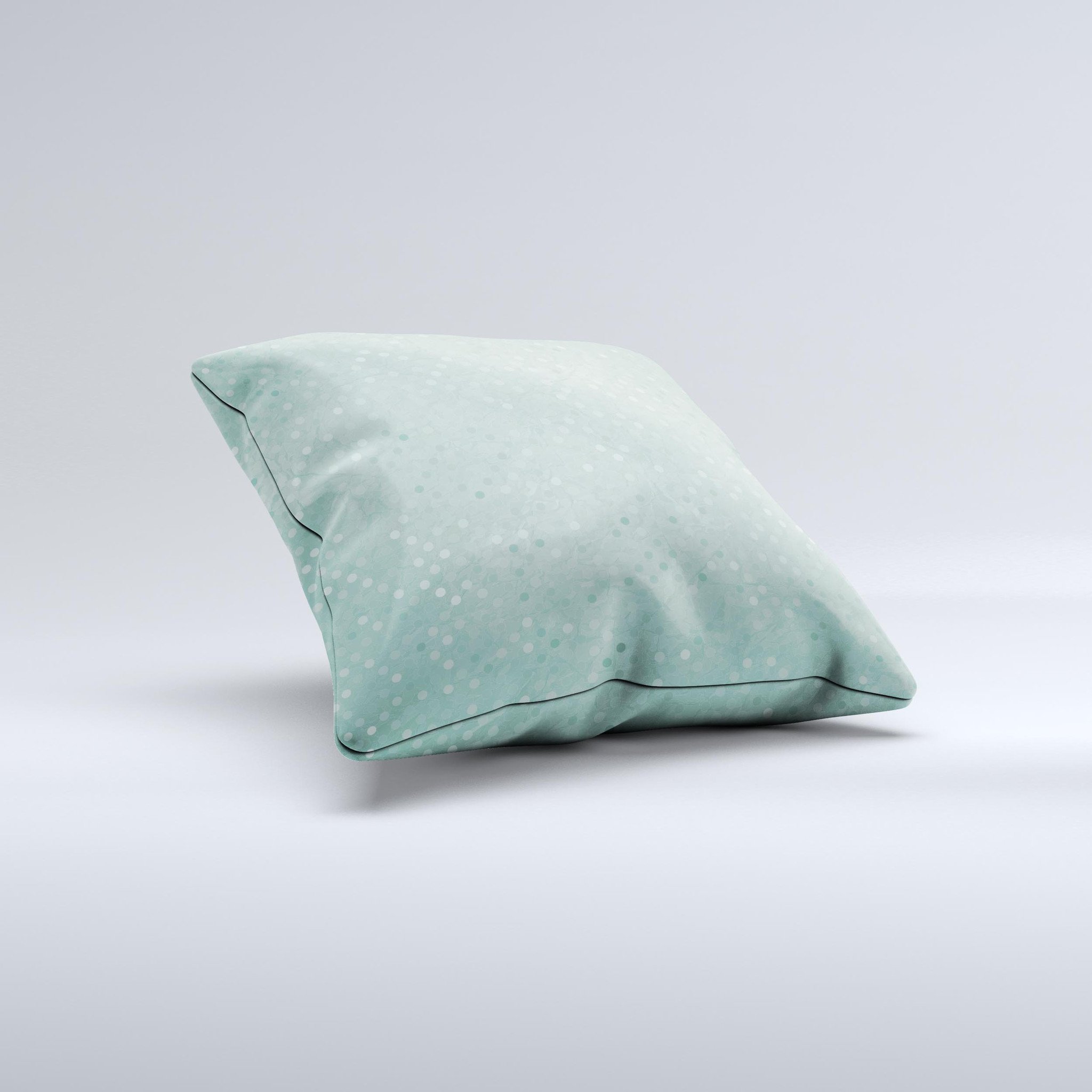 Small green decorative throw pillow with polkadots, handcrafted in Virginia, showcasing unique design and high-quality fabric.