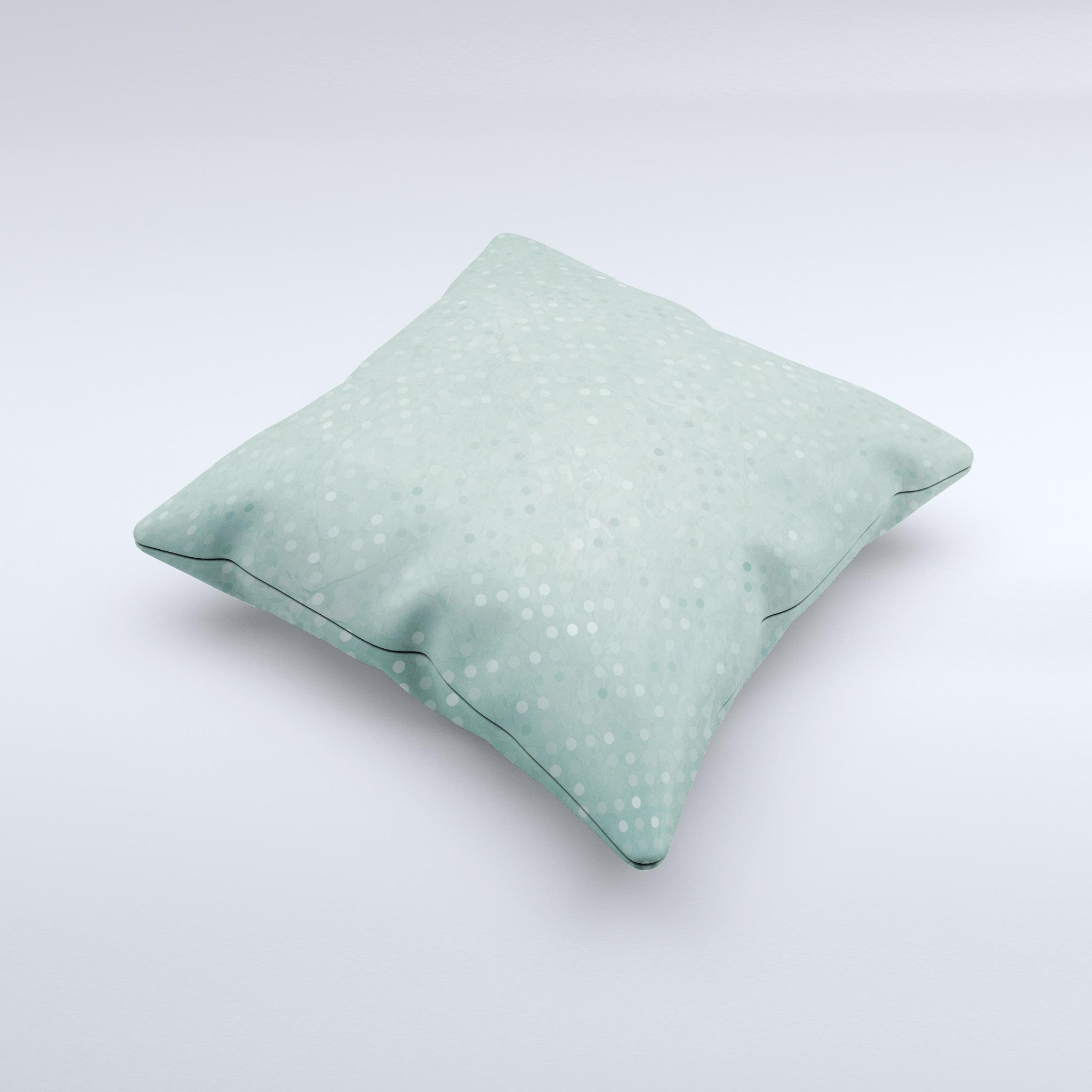 Small green decorative throw pillow with polkadots, handcrafted in Virginia, showcasing unique design and high-quality fabric.