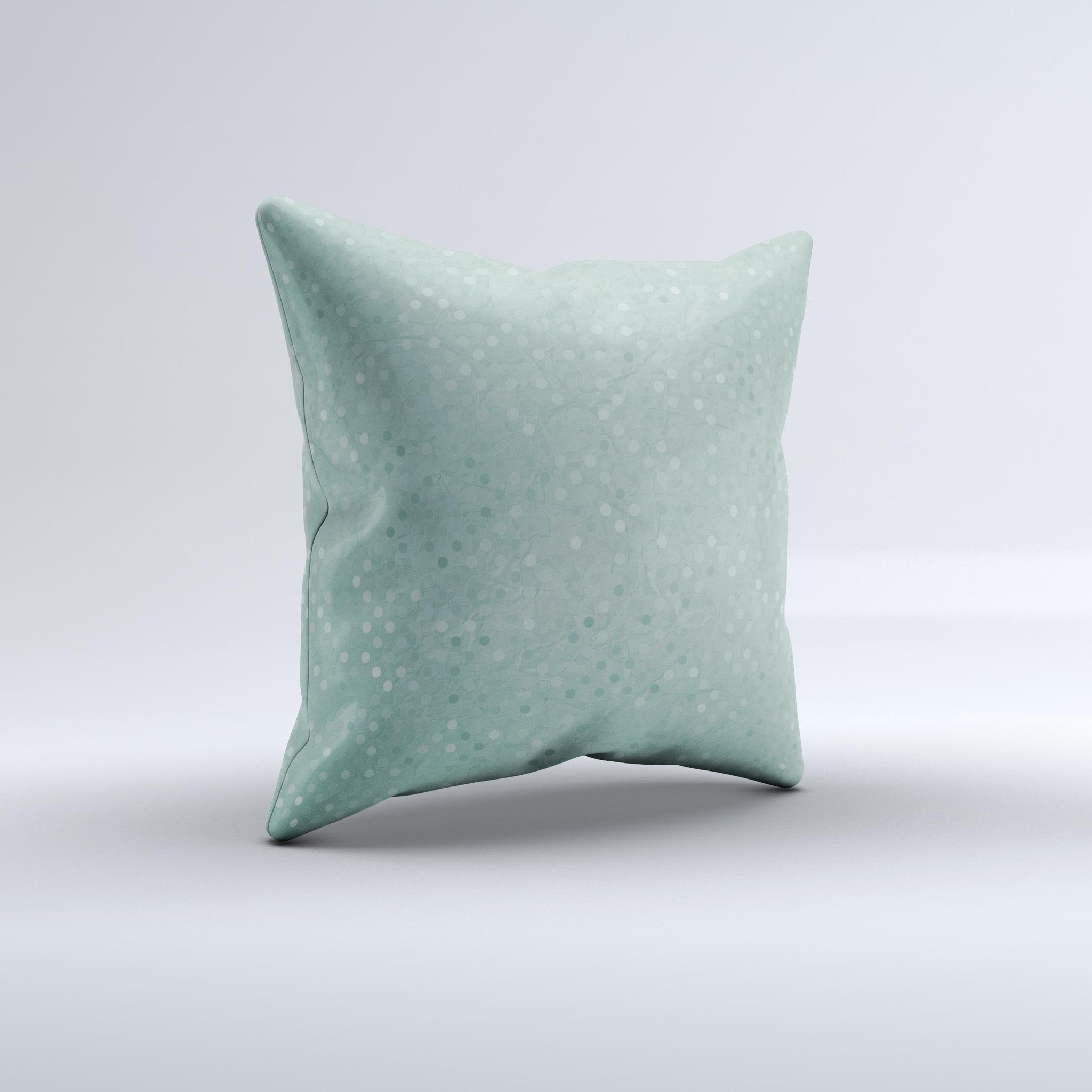 Small green decorative throw pillow with polkadots, handcrafted in Virginia, showcasing unique design and high-quality fabric.