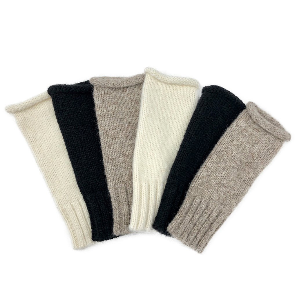 A pair of stylish Snow Essential Knit Alpaca Gloves in snow color, featuring a fingerless design and ribbed cuffs, handmade in Peru.