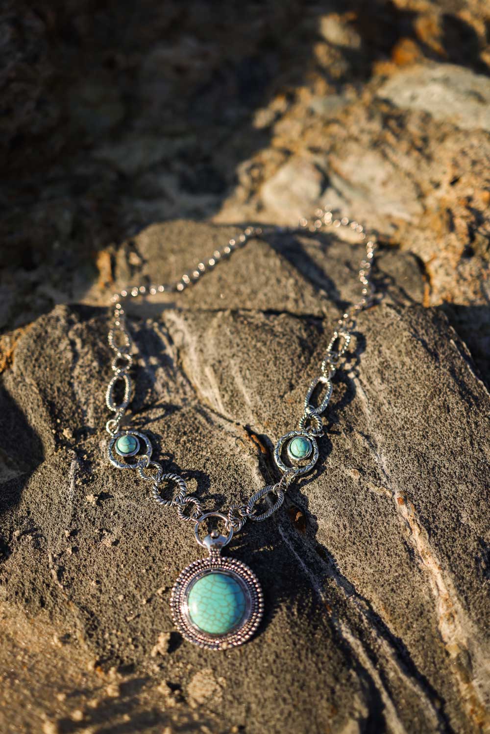 Soleil Turquoise & Silver Link Necklace featuring a vibrant turquoise pendant and a silver chain with turquoise accents.