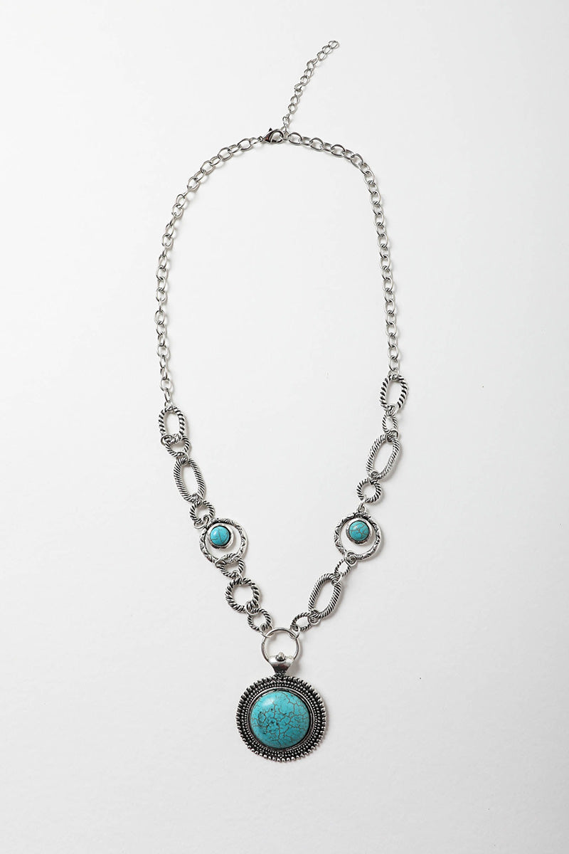 Soleil Turquoise & Silver Link Necklace featuring a vibrant turquoise pendant and a silver chain with turquoise accents.
