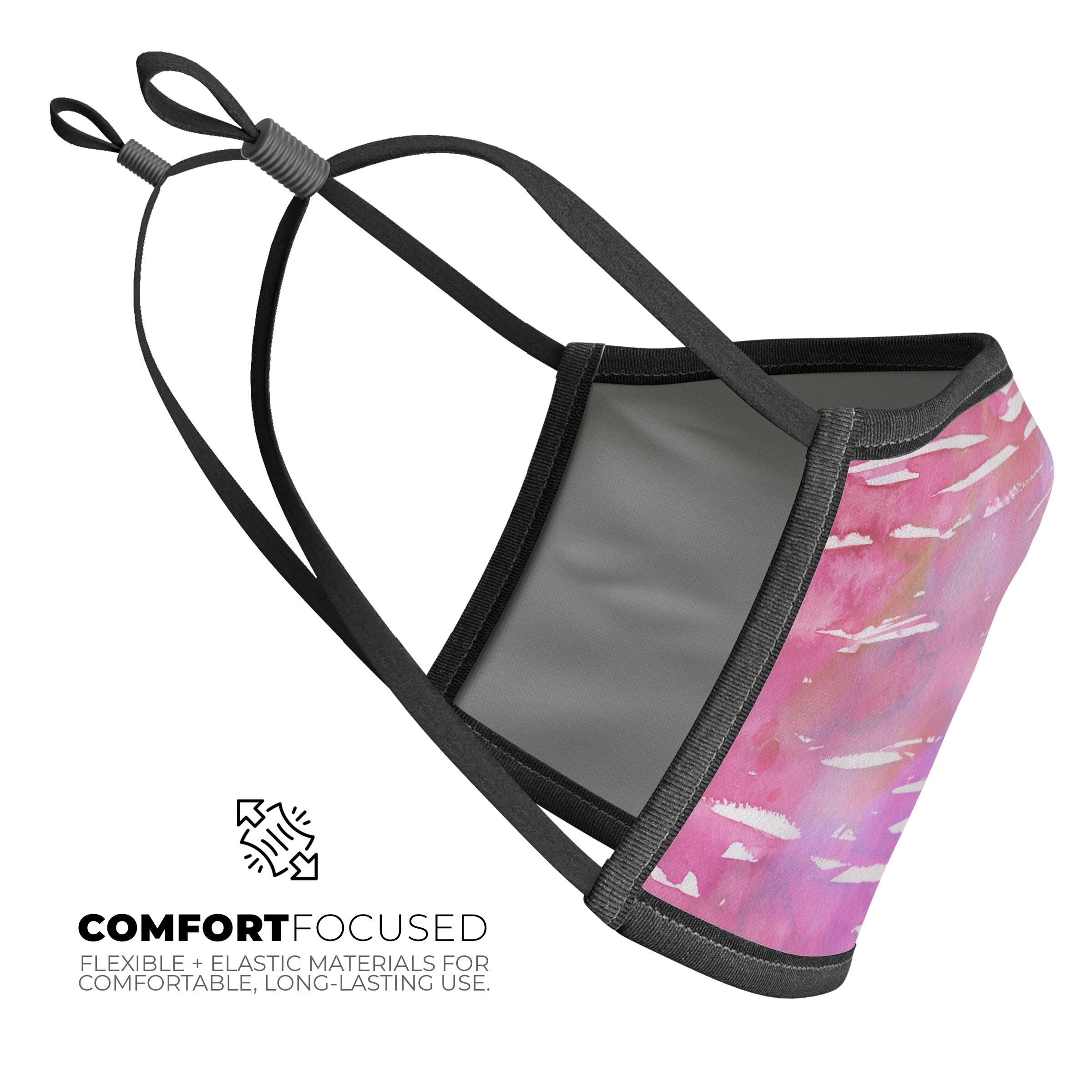 Splattered Pink 3D face mask made in the USA, featuring adjustable ear loops and a soft cotton interior for comfort.