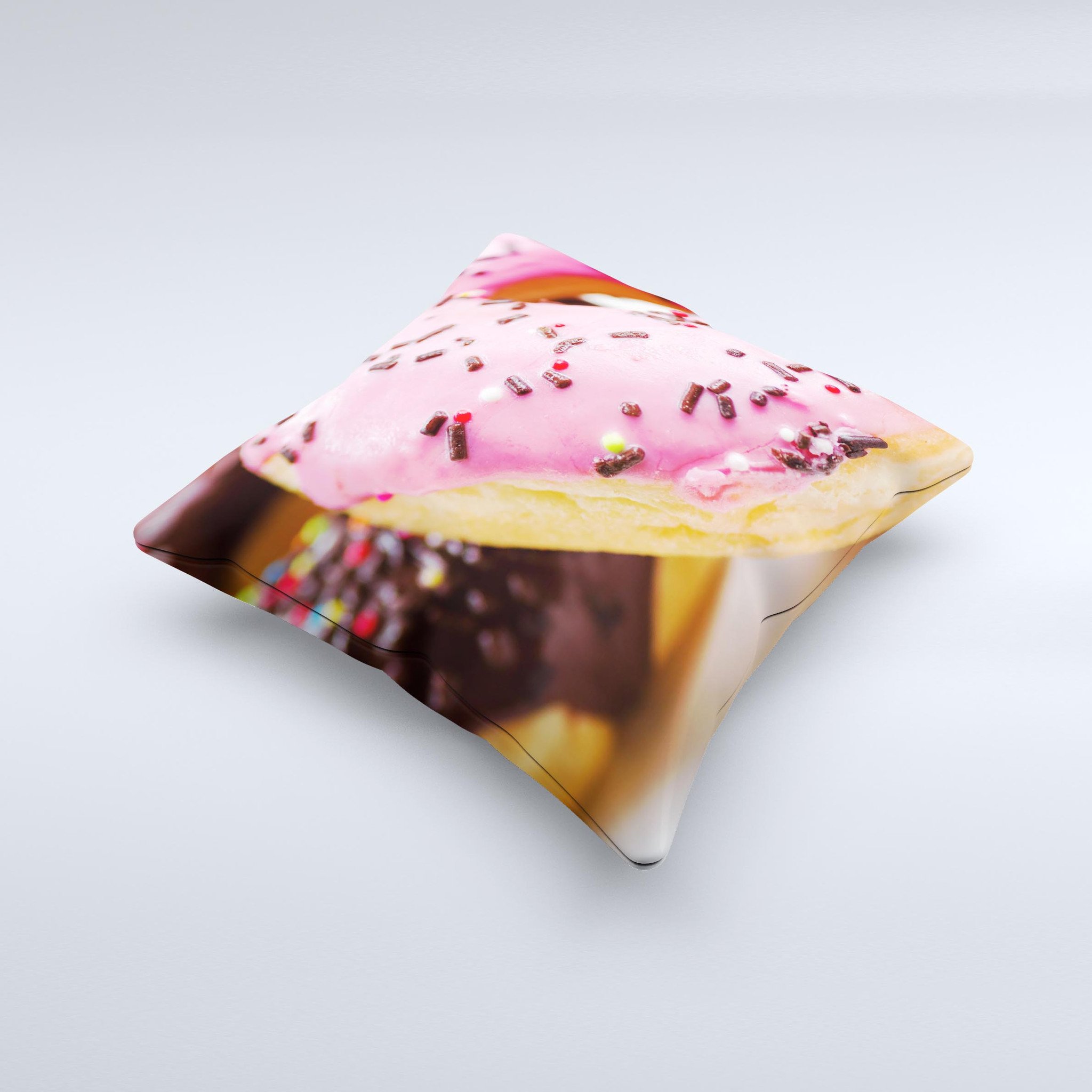 A colorful decorative throw pillow featuring a whimsical sprinkled donuts design, handcrafted in Virginia.