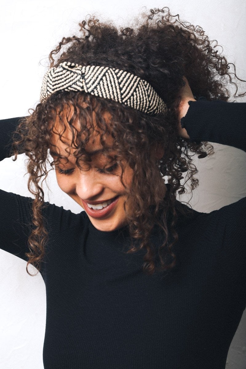 A stylish straw rattan knotted headband, perfect for elevating any hairstyle with a chic touch.