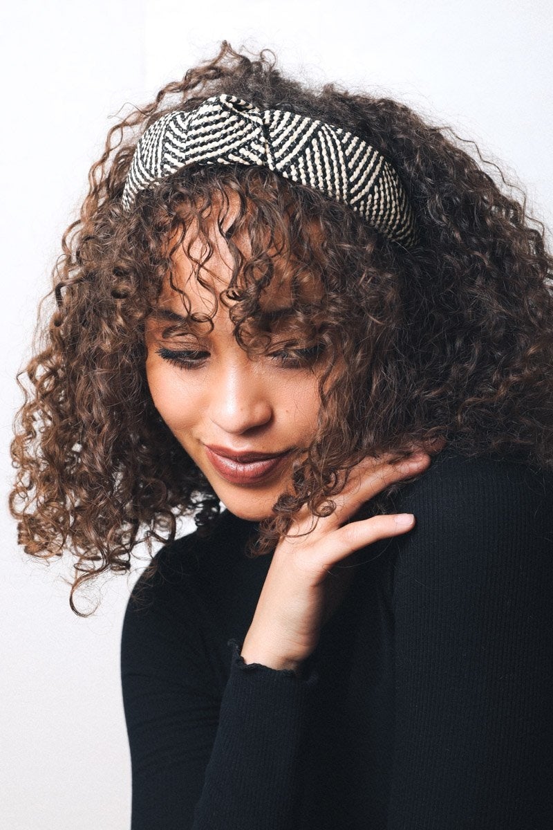 A stylish straw rattan knotted headband, perfect for elevating any hairstyle with a chic touch.