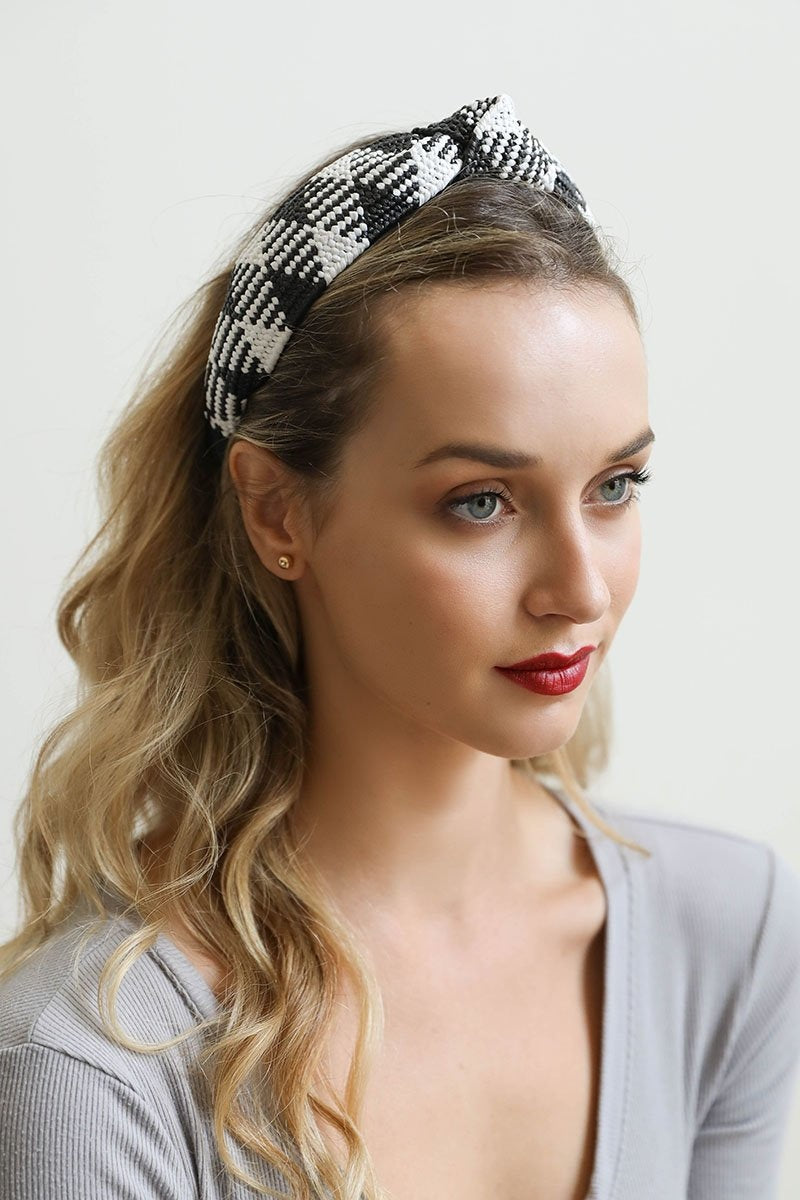 A stylish straw rattan knotted headband, perfect for elevating any hairstyle with a chic touch.