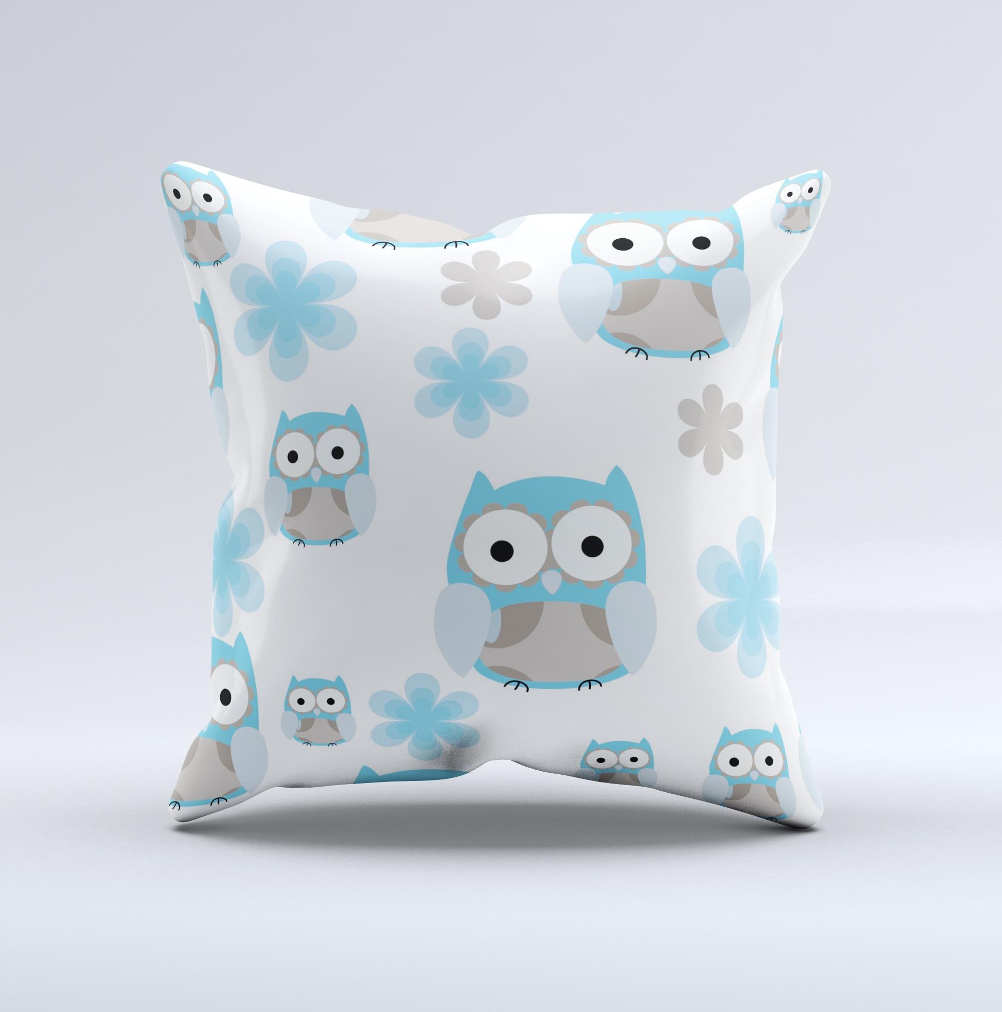 A decorative throw pillow featuring subtle blue cartoon owls, handcrafted in Virginia with high-quality fabric and unique design.