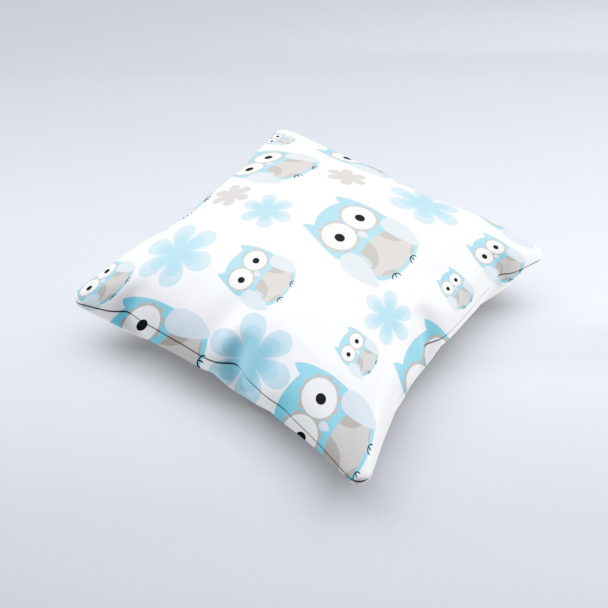 A decorative throw pillow featuring subtle blue cartoon owls, handcrafted in Virginia with high-quality fabric and unique design.