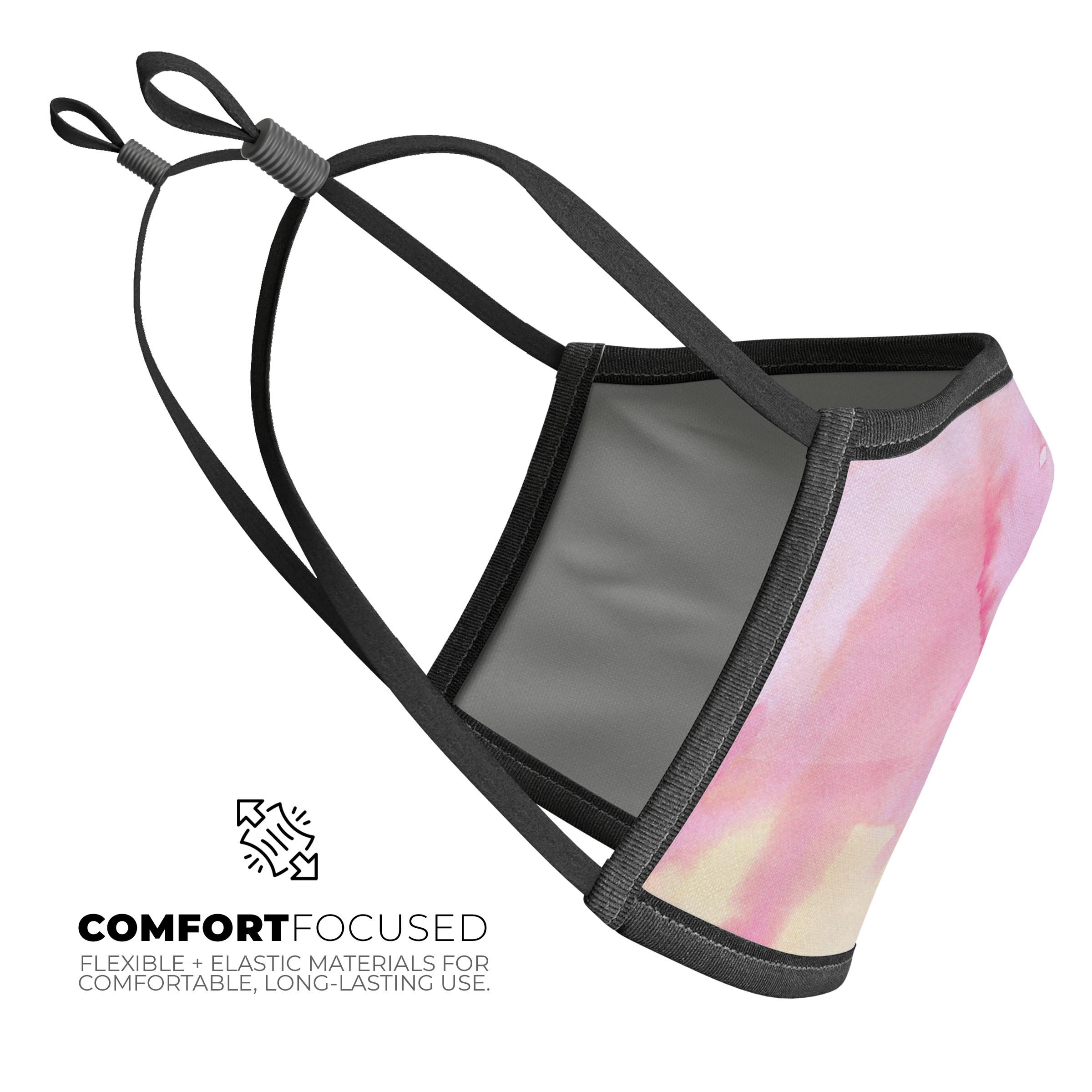 Subtle Pink Absorbed Watercolor Texture reusable mouth cover, showcasing a vibrant design and adjustable ear loops.
