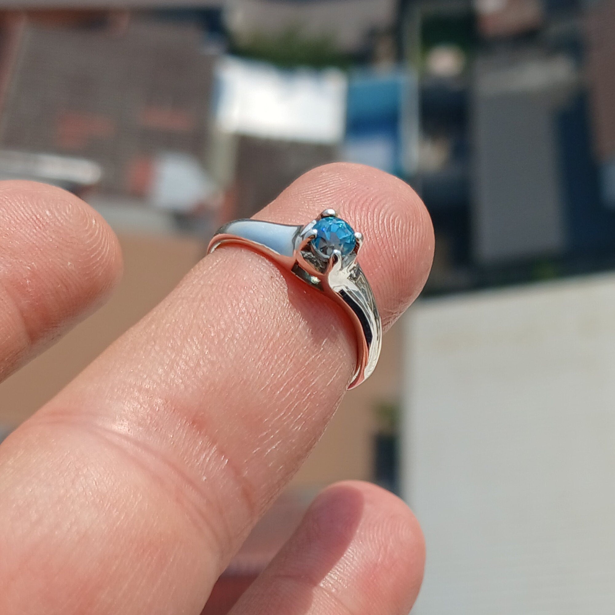 Sweet Blue Zircon Ring in sterling silver featuring an oval cut blue zircon gemstone, elegantly designed for sophistication.