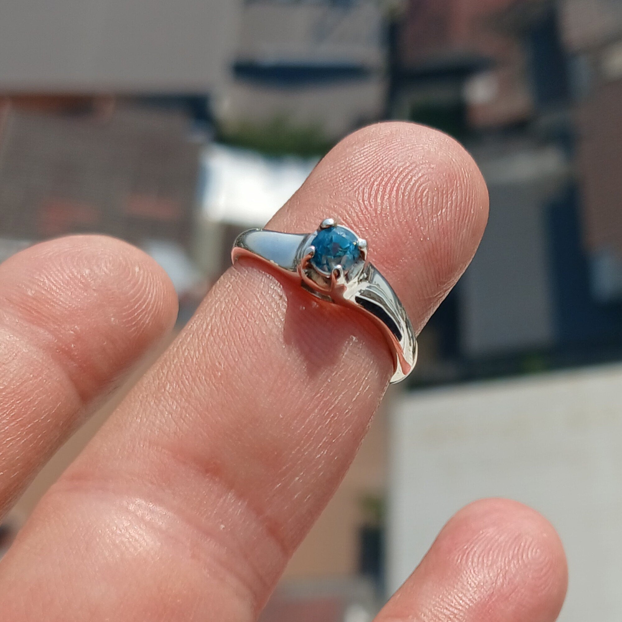 Sweet Blue Zircon Ring in sterling silver featuring an oval cut blue zircon gemstone, elegantly designed for sophistication.