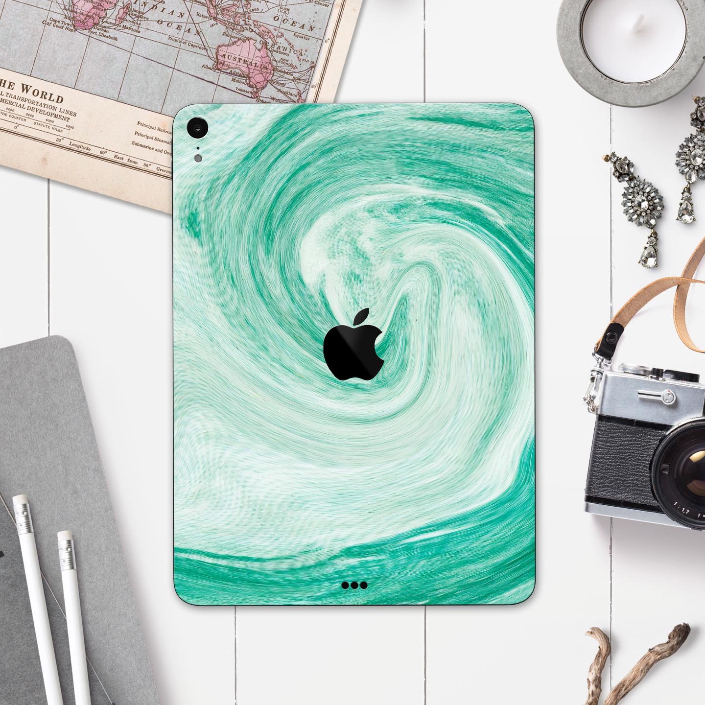 Swirling Mint Acrylic Marble skin decal for Apple iPad, showcasing a vibrant mint design with a glossy finish.