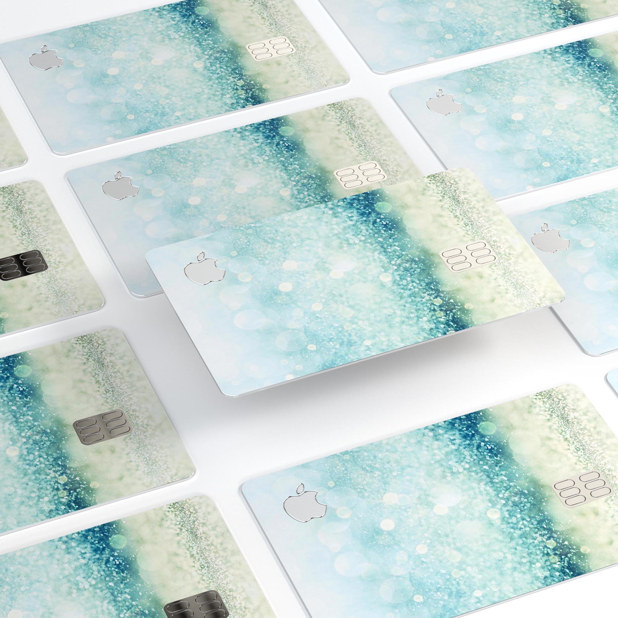 Teal and Aqua Unfocused Sparkling Orbs decal on an Apple Card, showcasing vibrant colors and a protective finish.