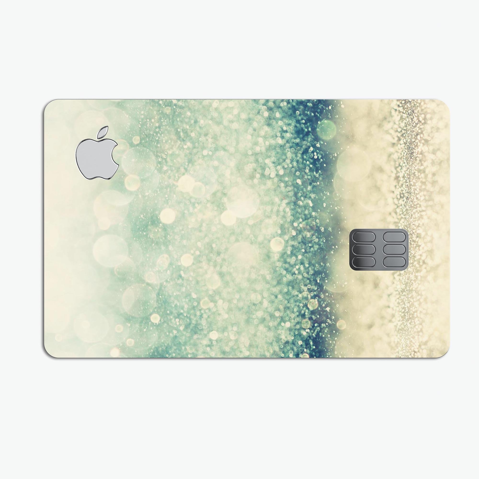 Teal and Gold Unfocused Orbs of Light decal applied on an Apple Card, showcasing its vibrant design and premium finish.