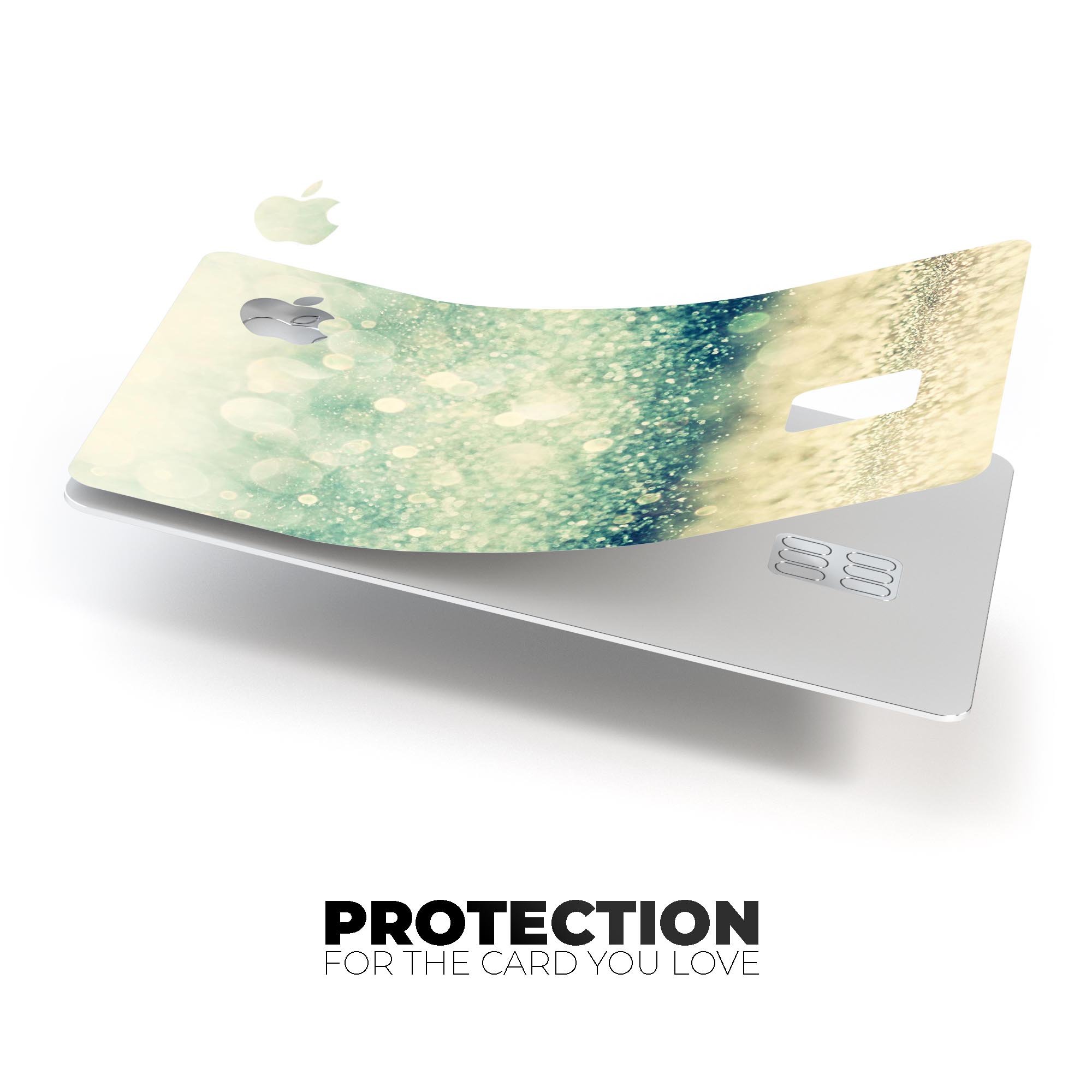 Teal and Gold Unfocused Orbs of Light decal applied on an Apple Card, showcasing its vibrant design and premium finish.