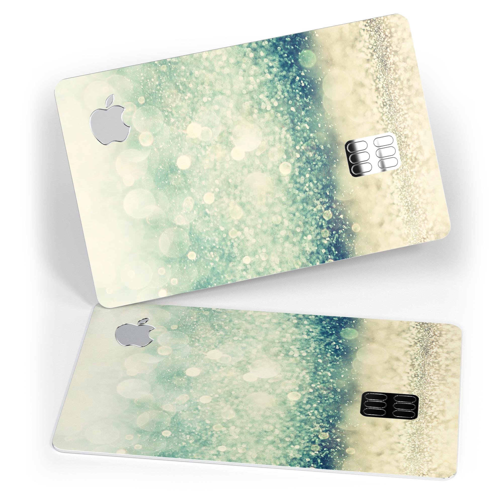 Teal and Gold Unfocused Orbs of Light decal applied on an Apple Card, showcasing its vibrant design and premium finish.