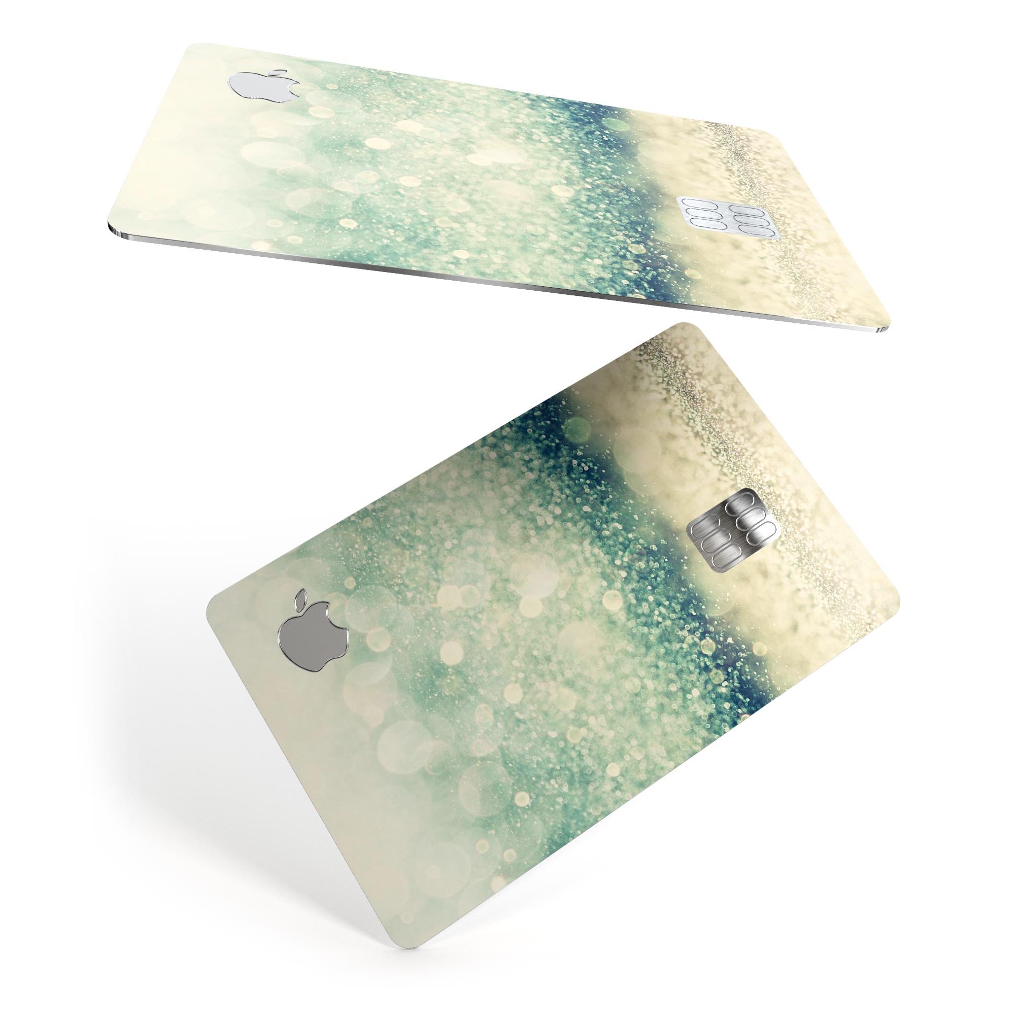 Teal and Gold Unfocused Orbs of Light decal applied on an Apple Card, showcasing its vibrant design and premium finish.