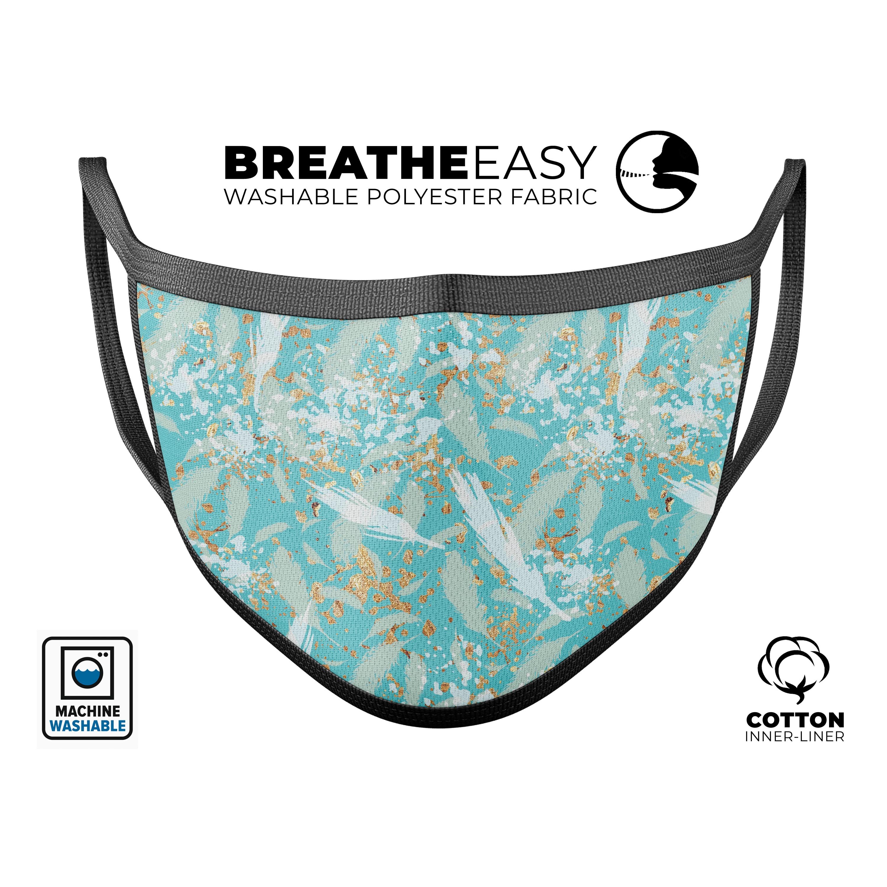 Teal and orange whispy waterstrokes design on a reusable 3D face mask, showcasing adjustable ear loops and soft cotton interior.