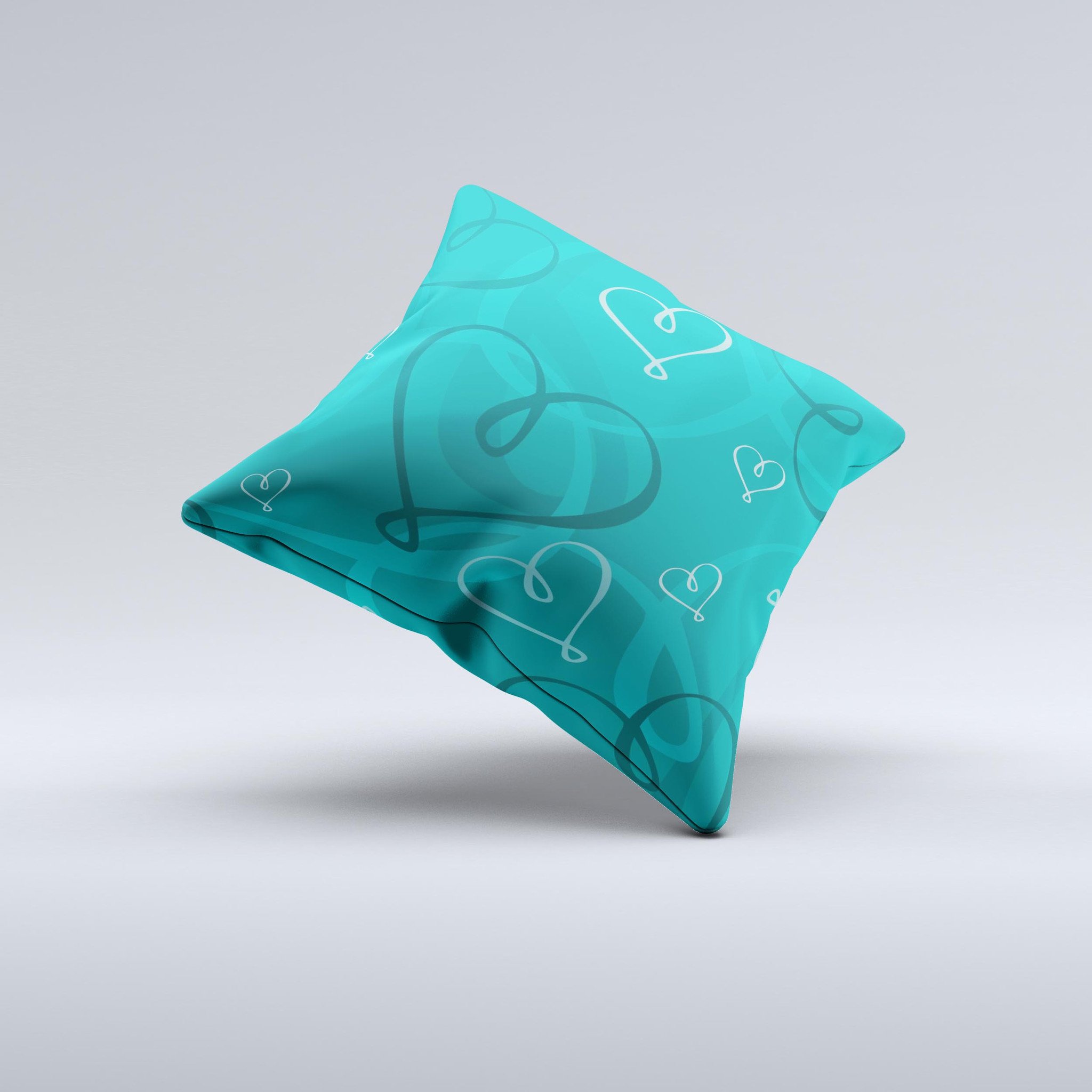 Teal decorative throw pillow featuring swirly love hearts design, handcrafted in Virginia with high thread count fabric.