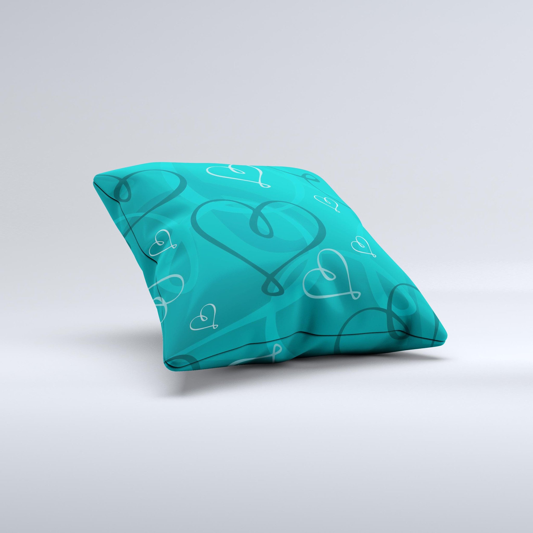 Teal decorative throw pillow featuring swirly love hearts design, handcrafted in Virginia with high thread count fabric.
