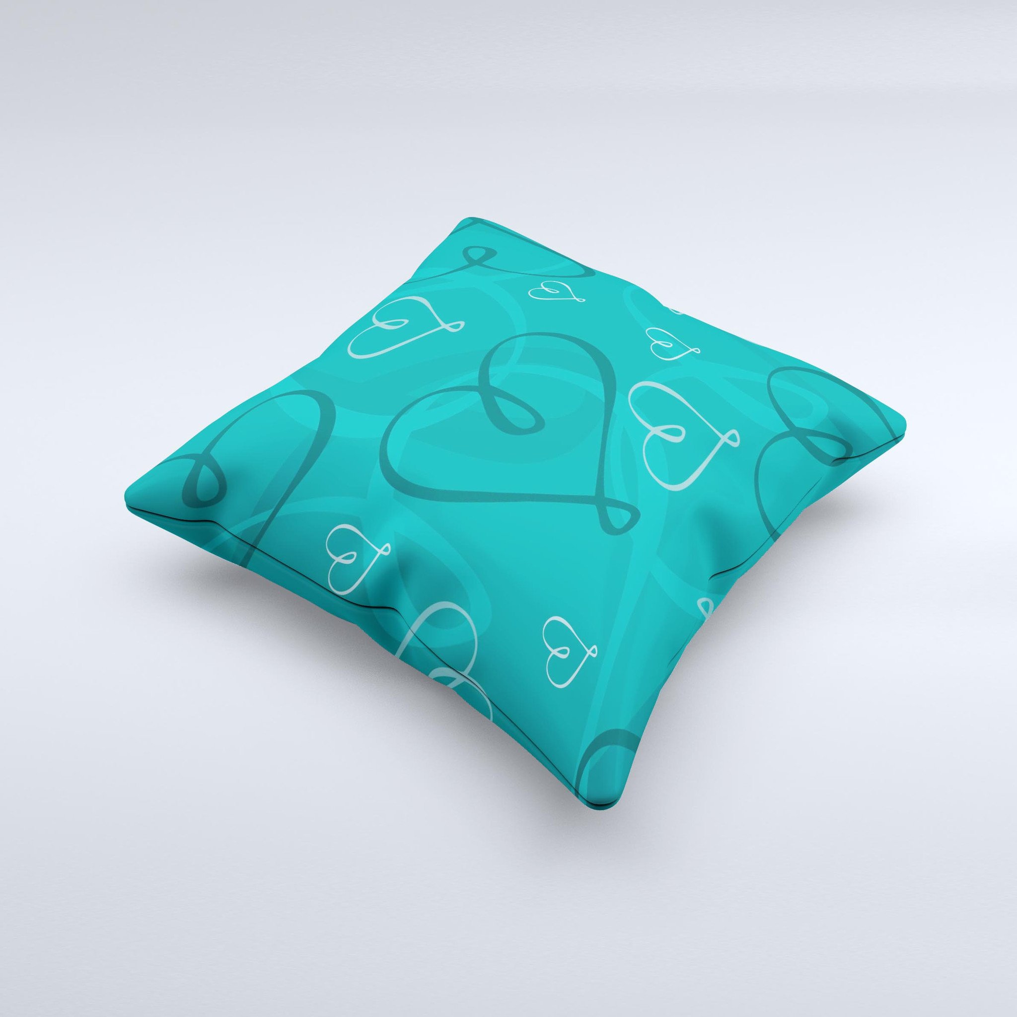 Teal decorative throw pillow featuring swirly love hearts design, handcrafted in Virginia with high thread count fabric.