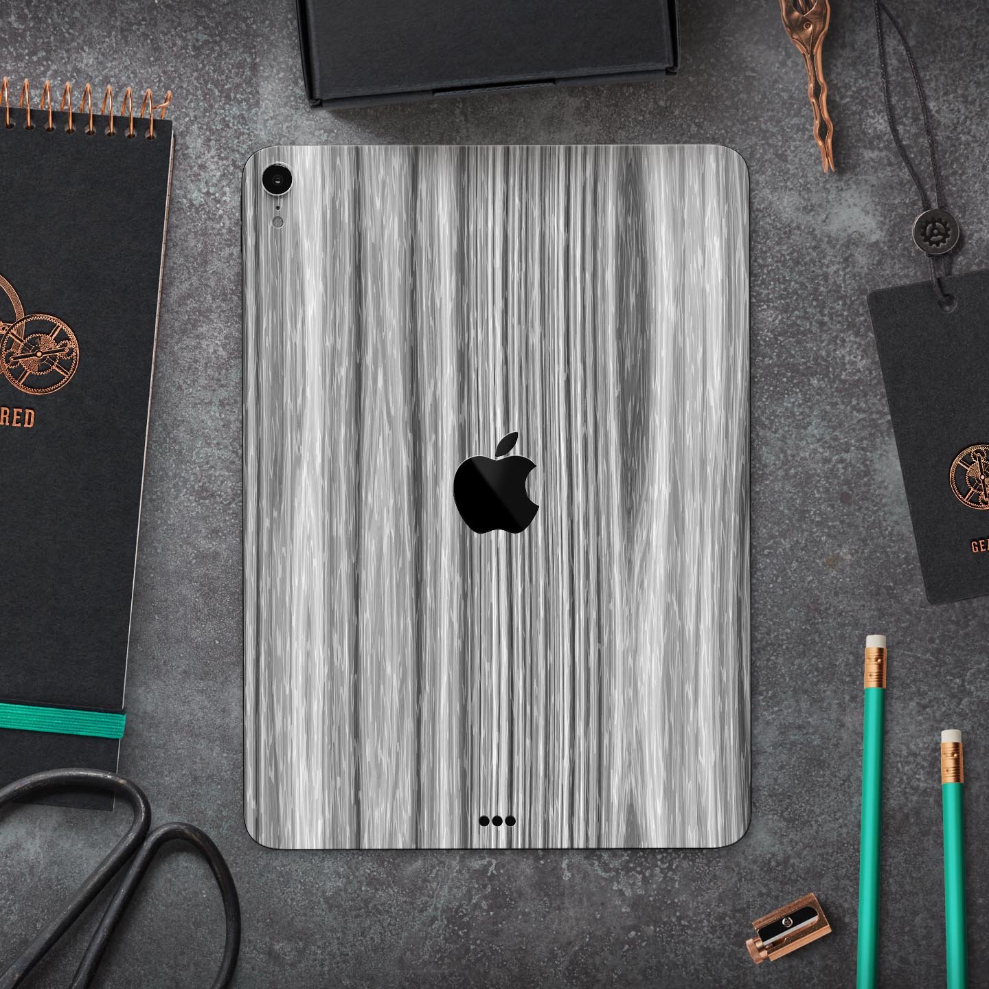 Textured Gray Dyed Surface skin decal for Apple iPad, showcasing its sleek design and premium 3M material.