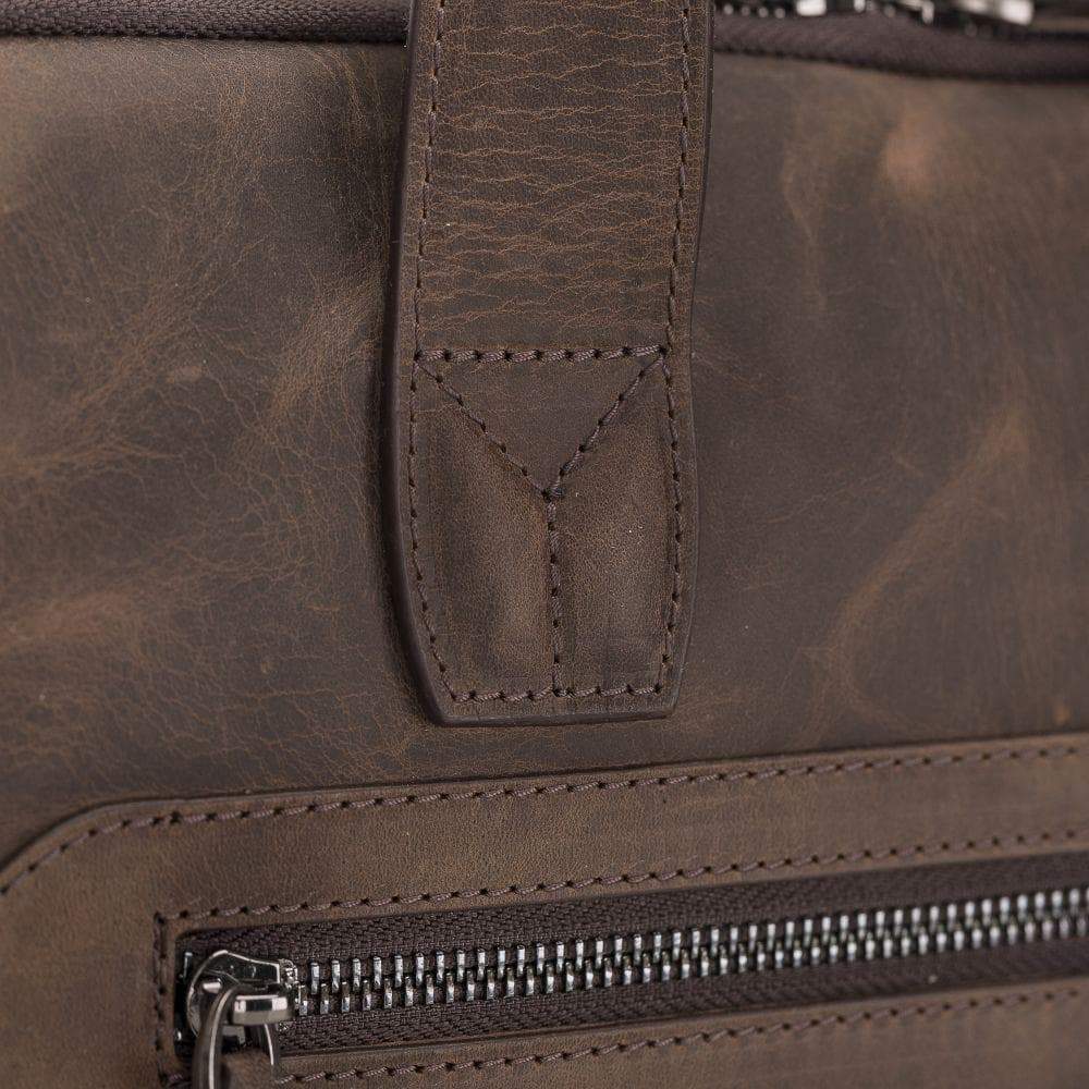 Thasos Leather Laptop Bag in rich brown leather with adjustable straps and multiple compartments for organization.