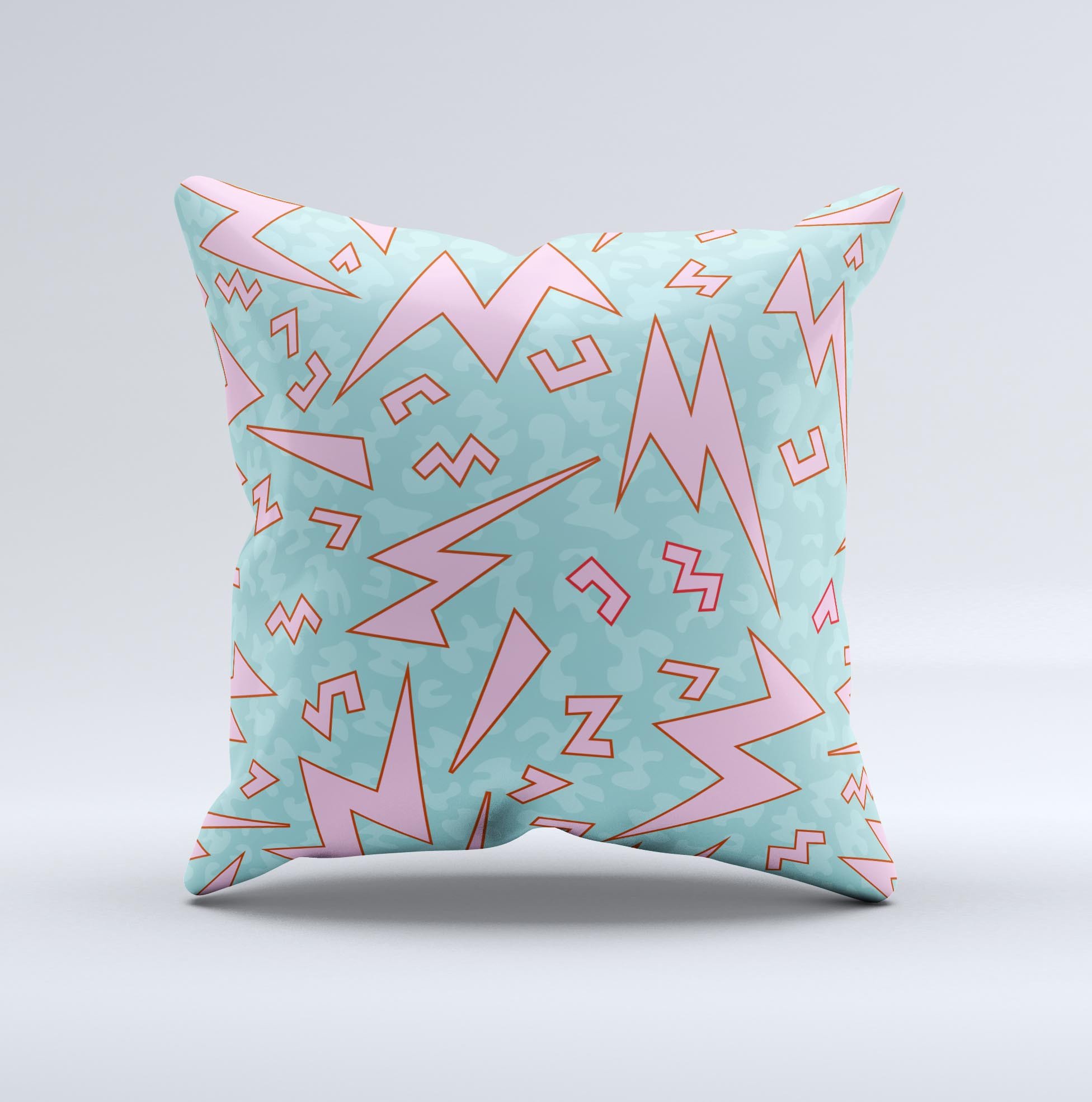 A colorful 90's zig zag decorative throw pillow, handcrafted in Virginia with a unique design and high-quality fabric.