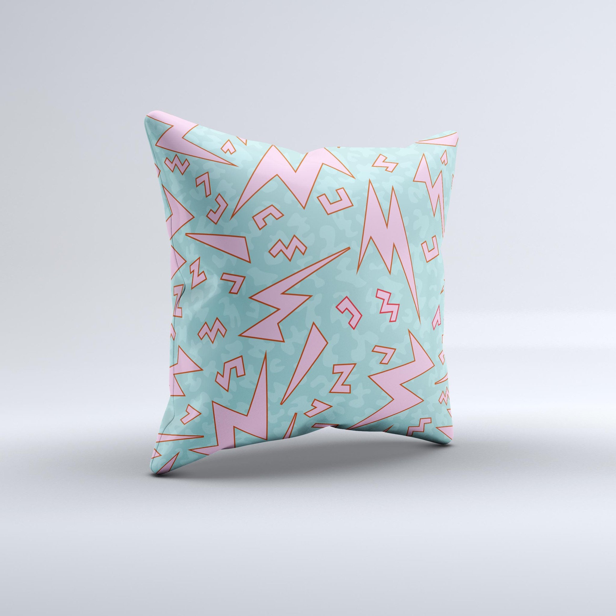 A colorful 90's zig zag decorative throw pillow, handcrafted in Virginia with a unique design and high-quality fabric.