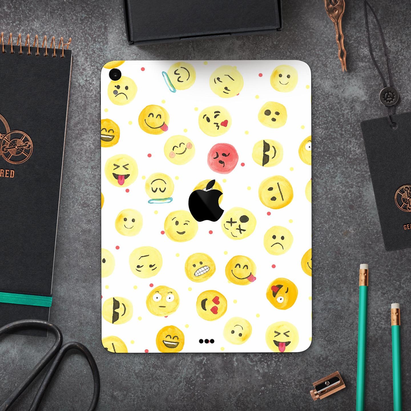 Full body skin decal featuring a colorful all-over emoji pattern designed for Apple iPad, showcasing vibrant graphics and a sleek finish.