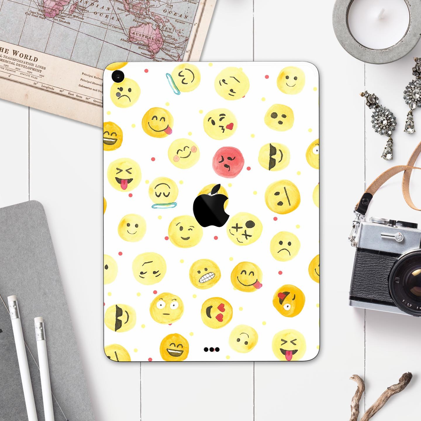 Full body skin decal featuring a colorful all-over emoji pattern designed for Apple iPad, showcasing vibrant graphics and a sleek finish.