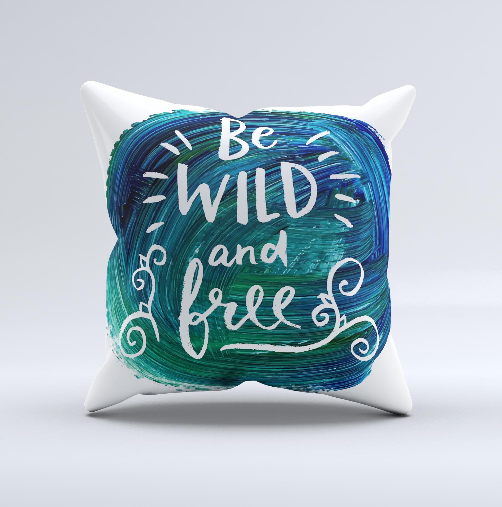 A handcrafted decorative throw pillow featuring the phrase 'Be Wild and Free' with a unique ink-fuzed design, made in Virginia.