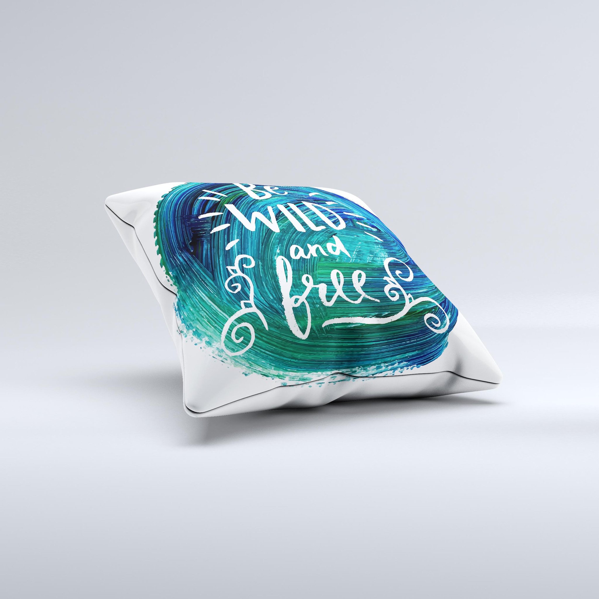 A handcrafted decorative throw pillow featuring the phrase 'Be Wild and Free' with a unique ink-fuzed design, made in Virginia.
