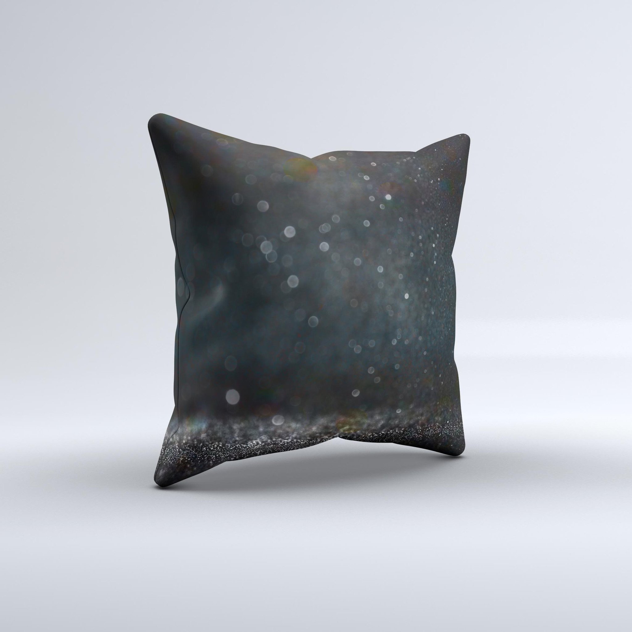 Black decorative throw pillow with unfocused glowing shimmer design, handcrafted in Virginia, showcasing unique imperfections.