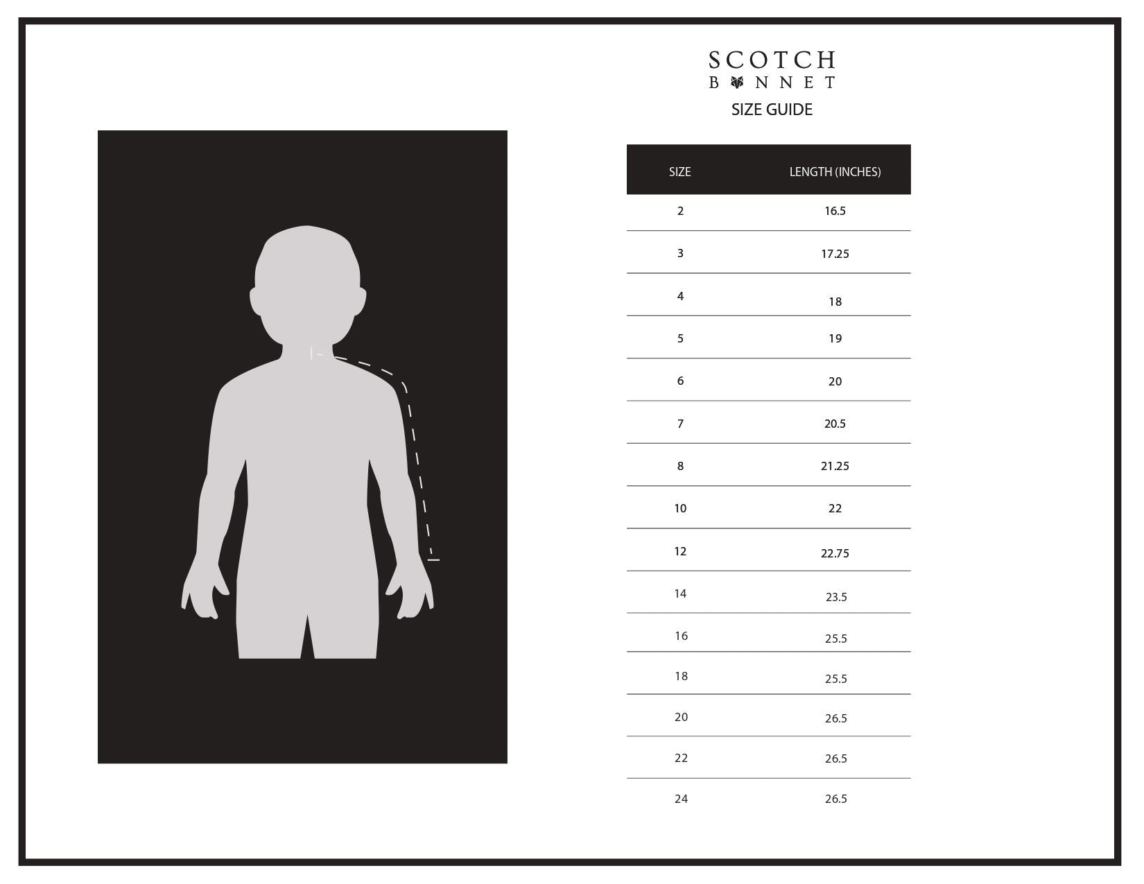 The Daphna scarf featuring playful pink pom poms, draped elegantly, showcasing its luxurious design and warm materials.