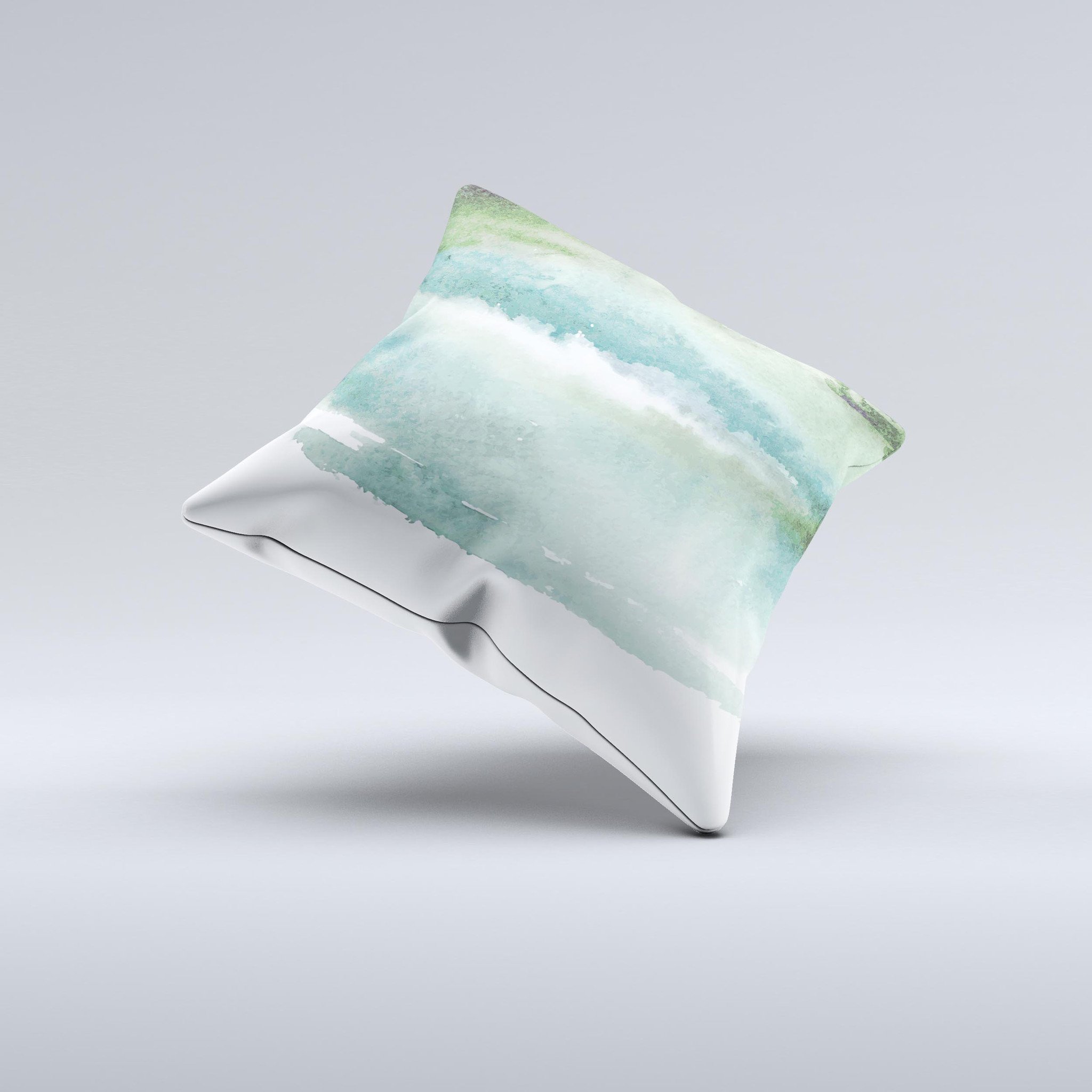 A decorative throw pillow featuring greenish watercolor strokes, handcrafted in Virginia, showcasing unique artistic design.