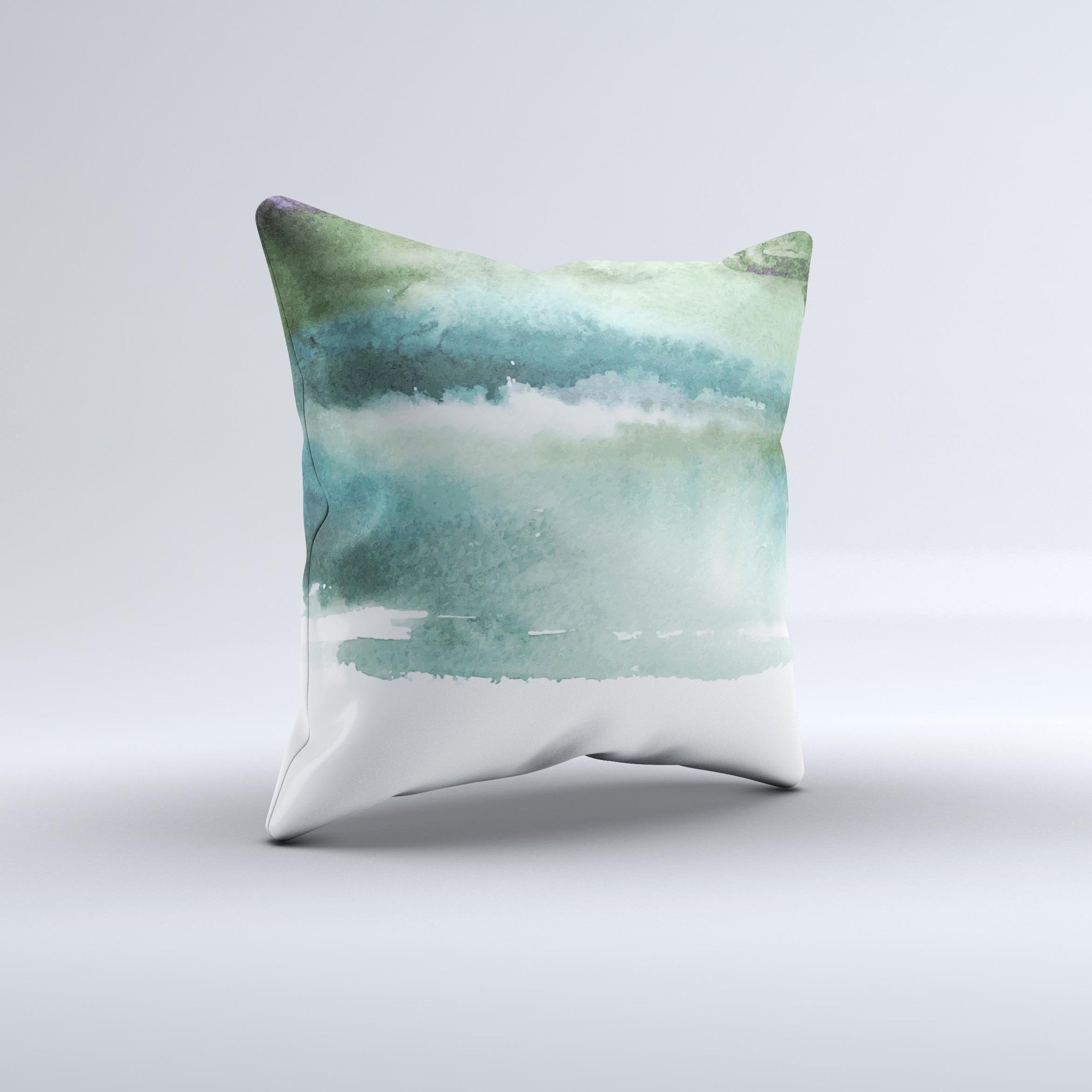 A decorative throw pillow featuring greenish watercolor strokes, handcrafted in Virginia, showcasing unique artistic design.