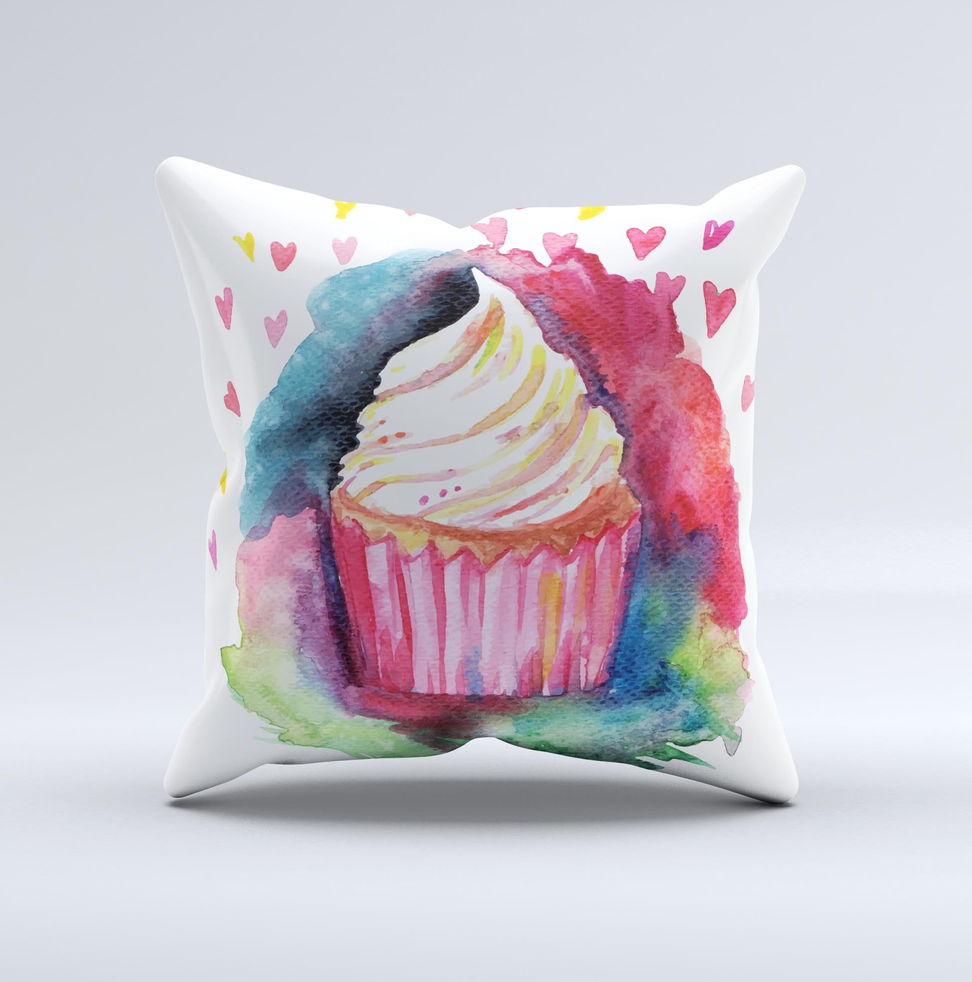 A beautifully crafted decorative throw pillow featuring watercolor ink designs of cupcakes, showcasing its unique handmade quality.