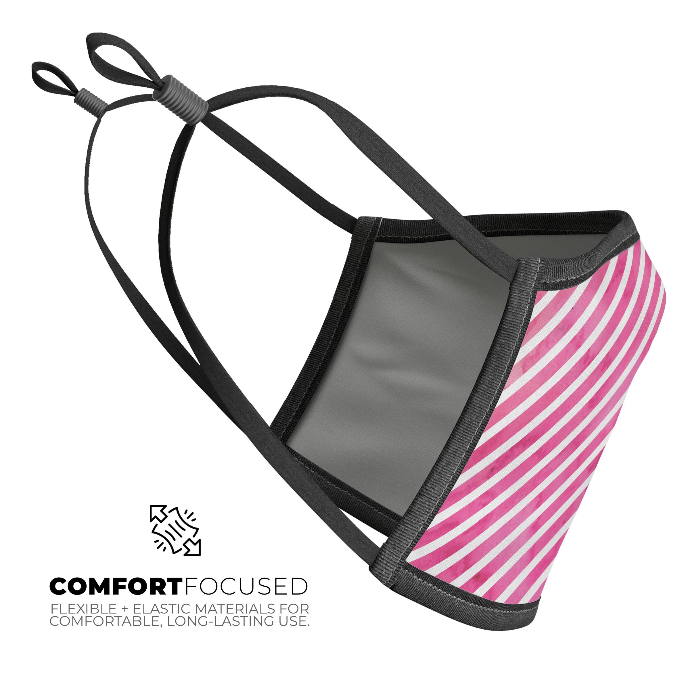 A vibrant pink watercolor grunge face mask with slanted stripes, showcasing a stylish design suitable for everyday use.