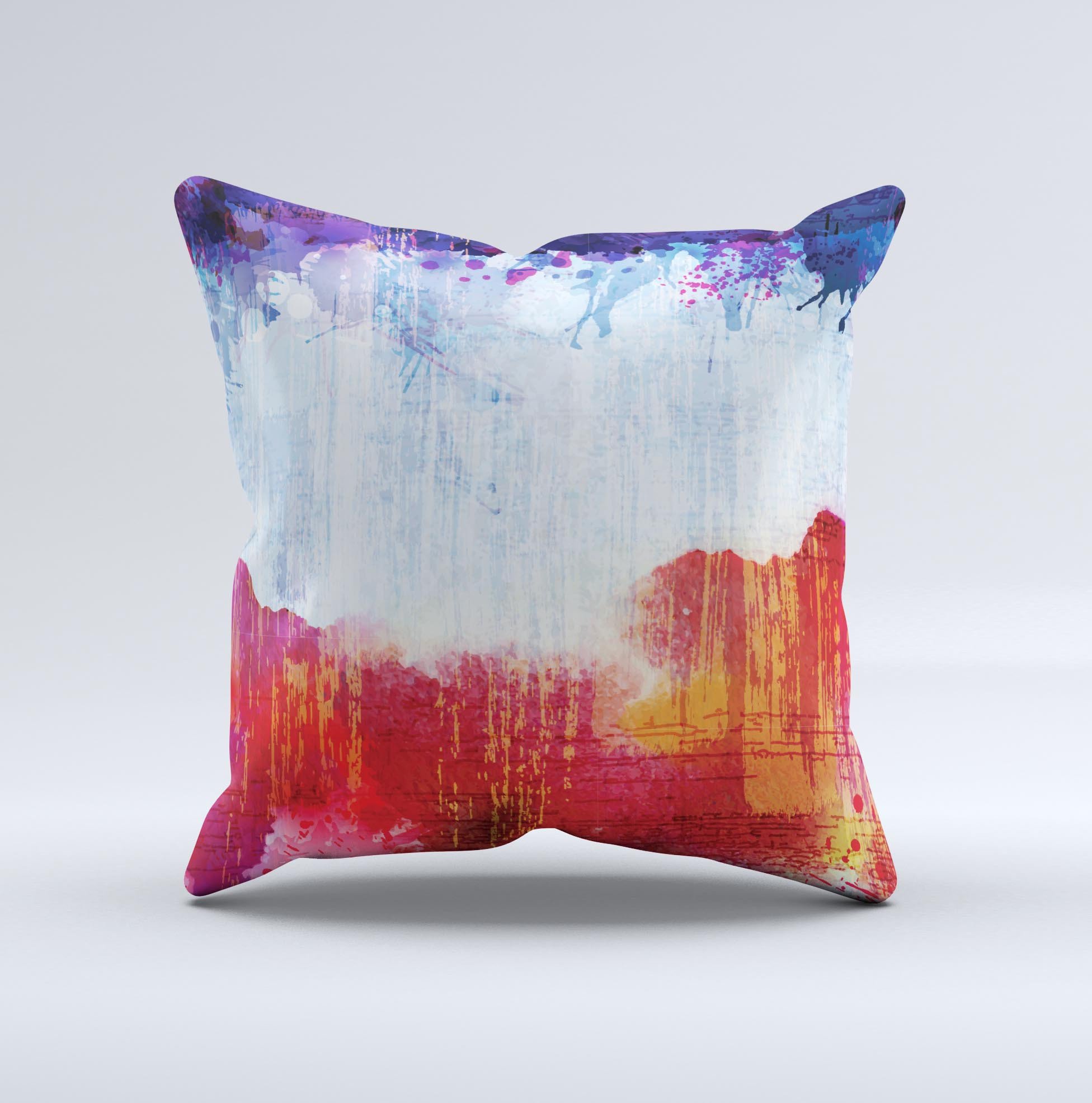 A decorative throw pillow featuring vibrant red, white, and blue paint splotches, handcrafted in Virginia, showcasing unique design elements.