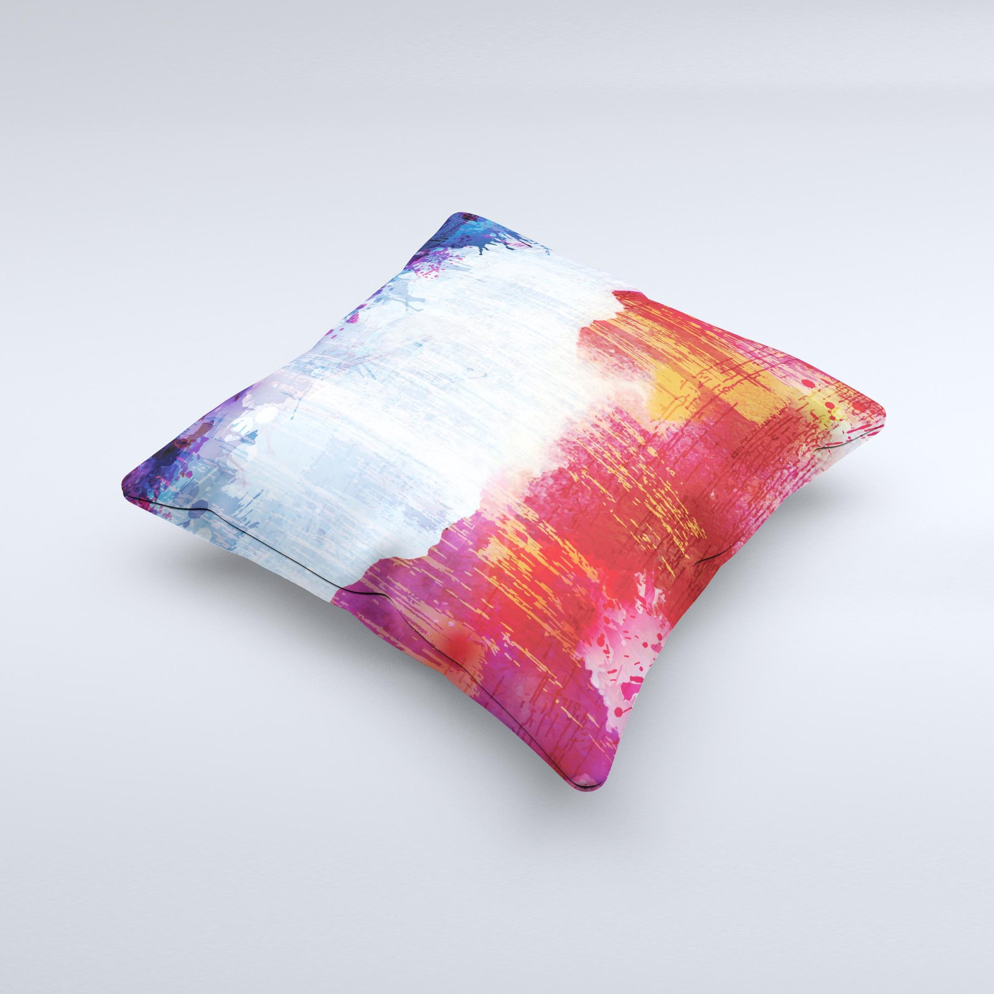 A decorative throw pillow featuring vibrant red, white, and blue paint splotches, handcrafted in Virginia, showcasing unique design elements.