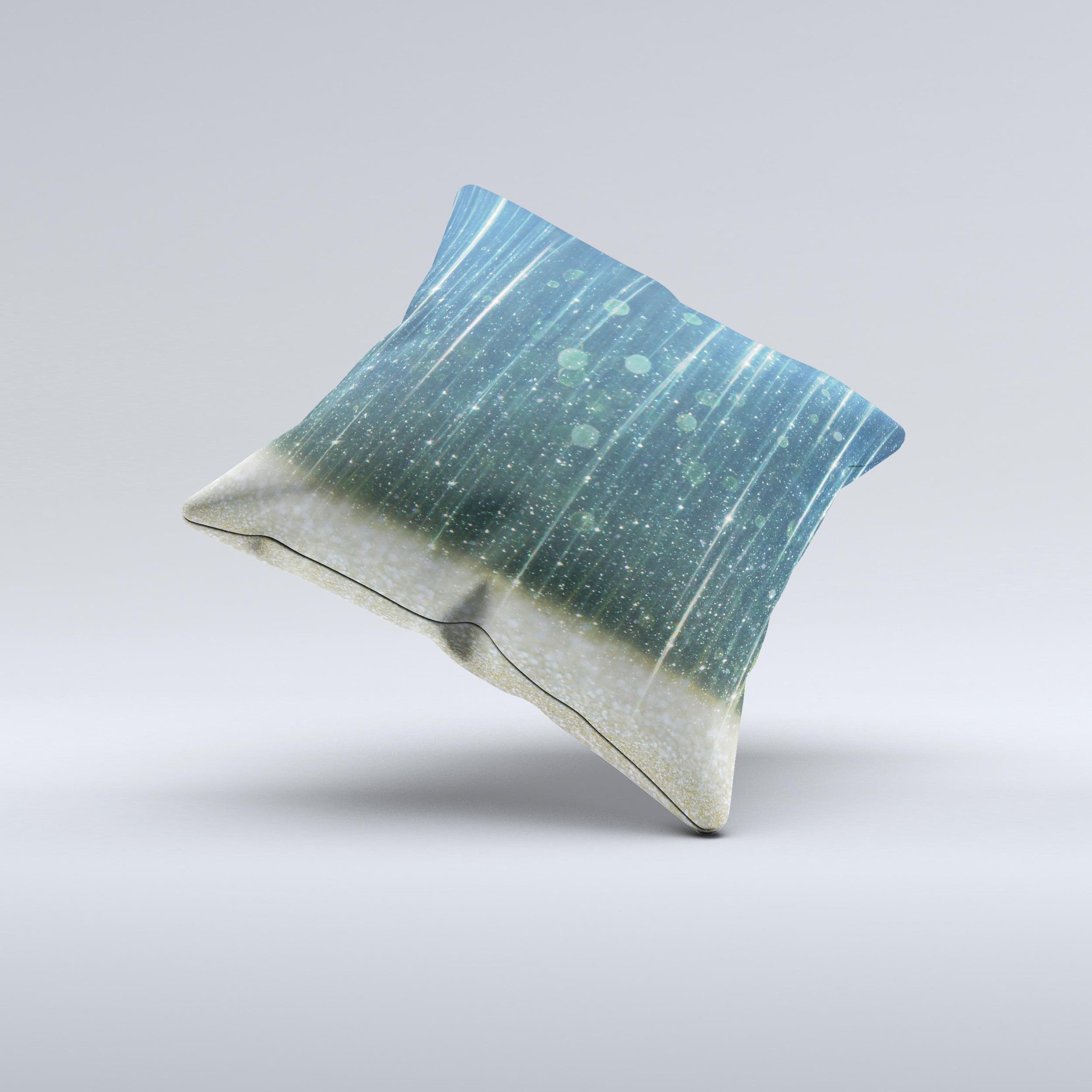A handcrafted decorative throw pillow featuring a scratched blue and gold design, showcasing unique patterns and textures.