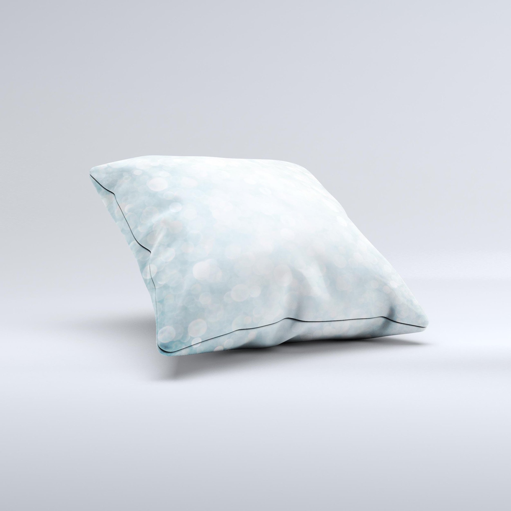 A decorative throw pillow featuring an unfocused blue orb lights design, handcrafted in Virginia with high-quality materials.