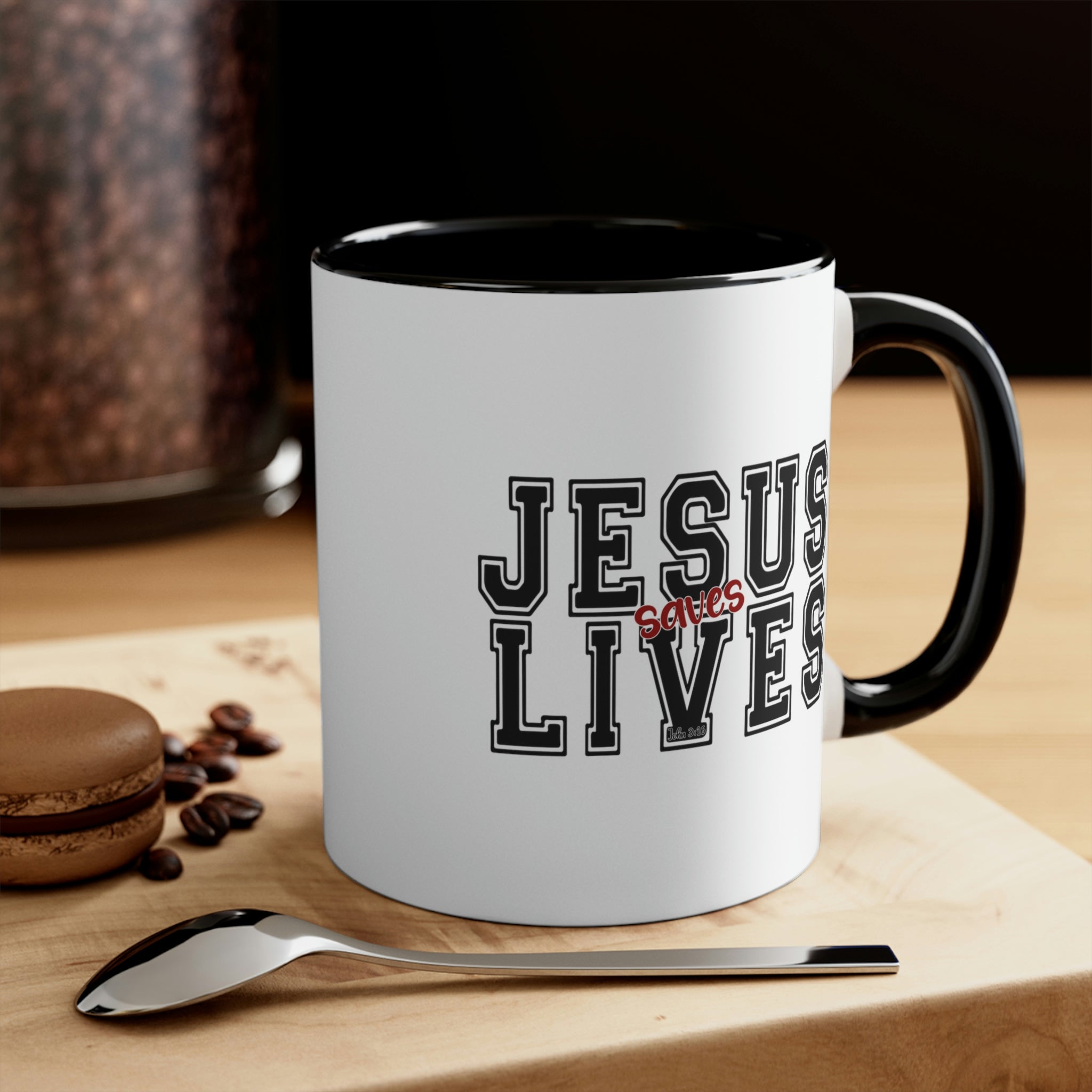 Two-tone ceramic mug with a C-handle, featuring a colored interior and the text 'Jesus Saves Lives' in a vibrant design.