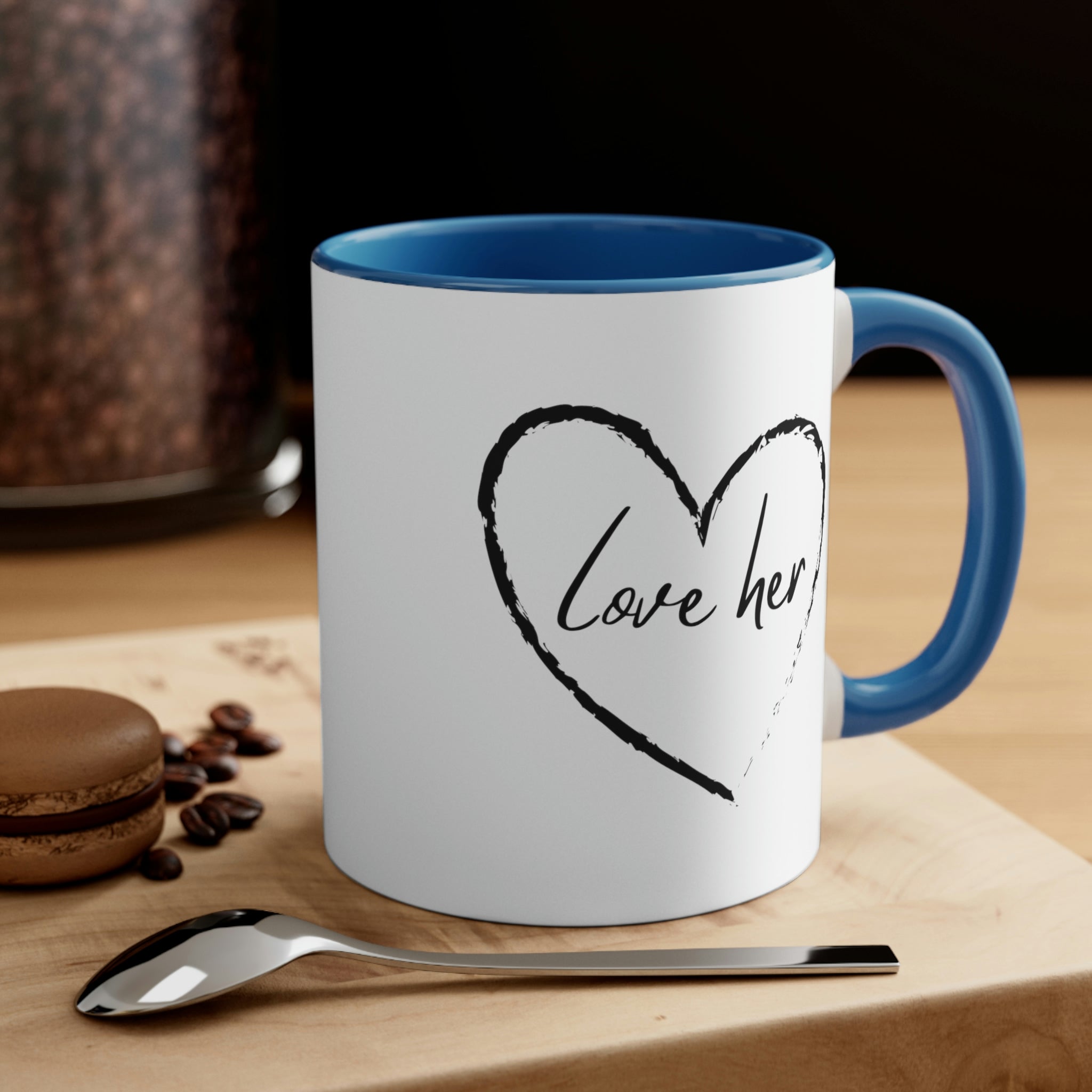 Two-tone ceramic mug with a white exterior and colorful interior and handle, featuring a comfortable C-handle design.