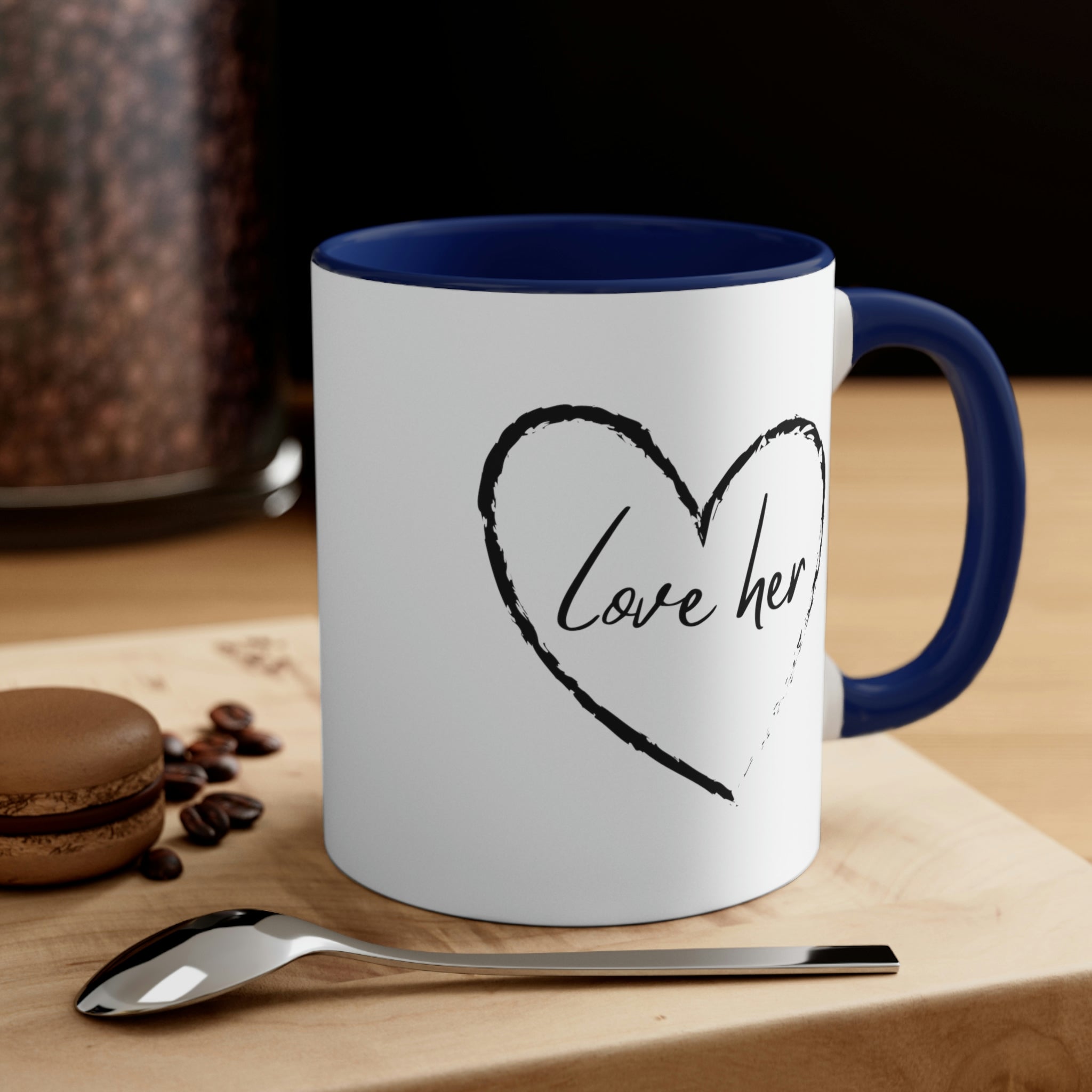 Two-tone ceramic mug with a white exterior and colorful interior and handle, featuring a comfortable C-handle design.