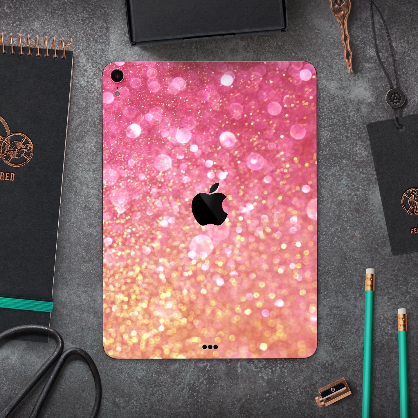 Unfocused Pink and Gold Orbs skin decal for Apple iPad, showcasing vibrant colors and a sleek design.
