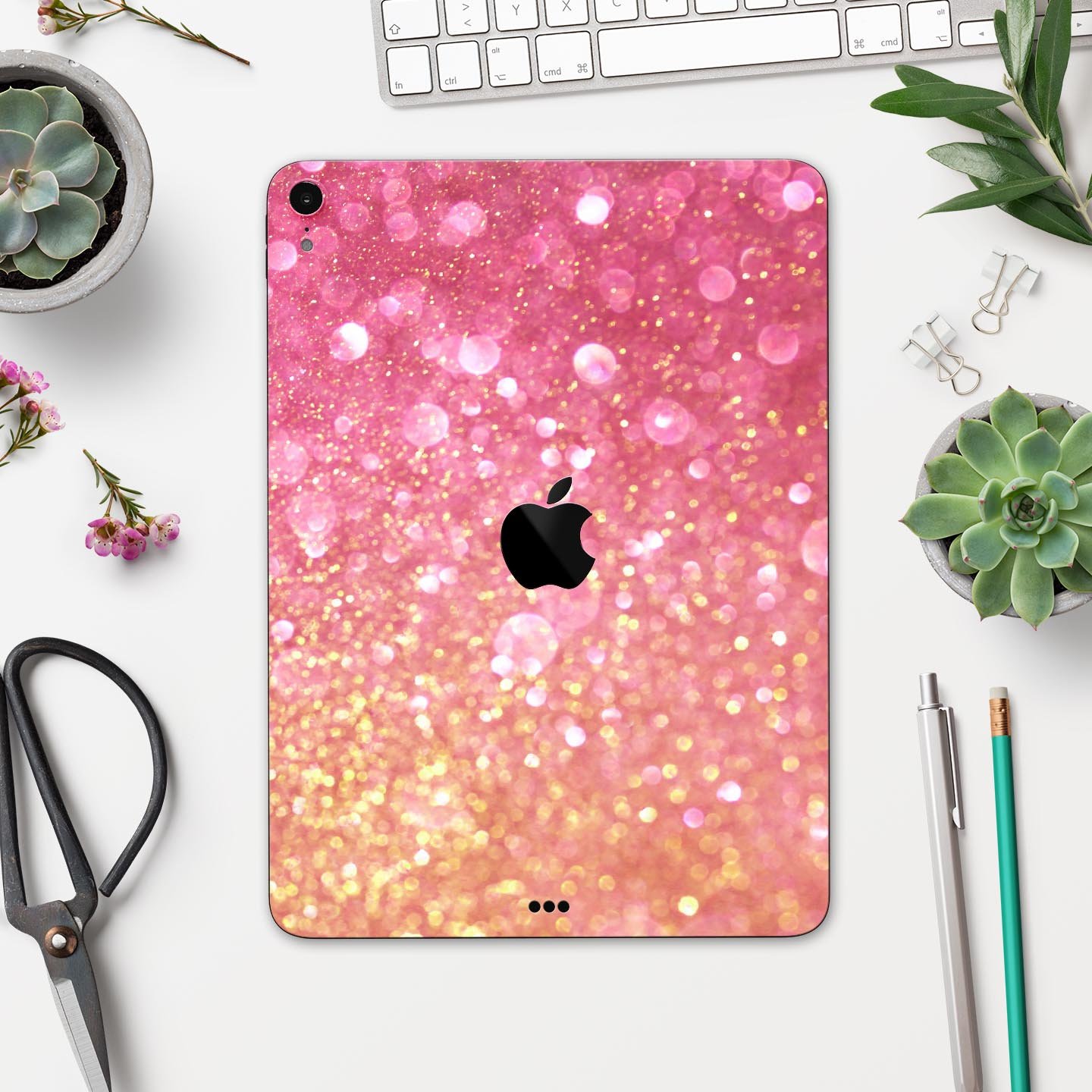 Unfocused Pink and Gold Orbs skin decal for Apple iPad, showcasing vibrant colors and a sleek design.