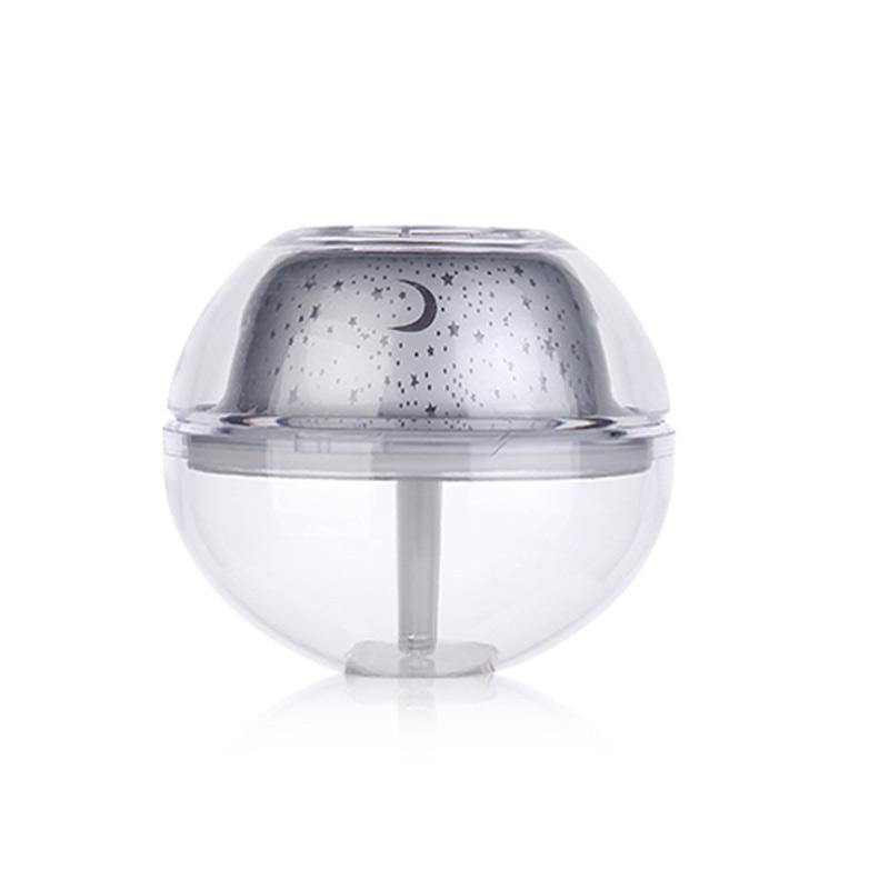 USB Crystal Night Lamp Projector with 500ml Air Humidifier, showcasing its sleek silver design and mist output.